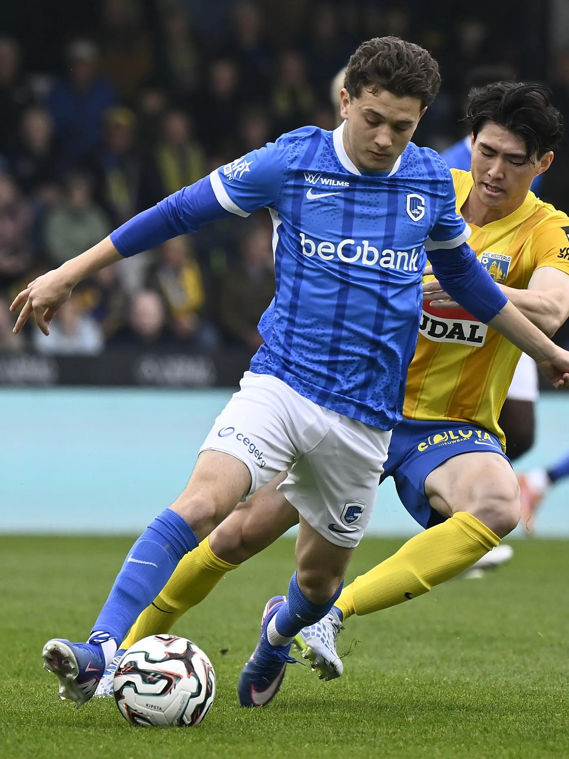 Genk's Konstantinos Kos Karetsas and Westerlo's Seji Kimura fight for the ball during a soccer match between KVC Westerlo and KRC Genk, Saturday 18 April 2026 in Westerlo, on the third day of the Europe Play-offs (PO2) of the 2025-2026 'Jupiler Pro League' first division of the Belgian championship. BELGA PHOTO JOHAN EYCKENS