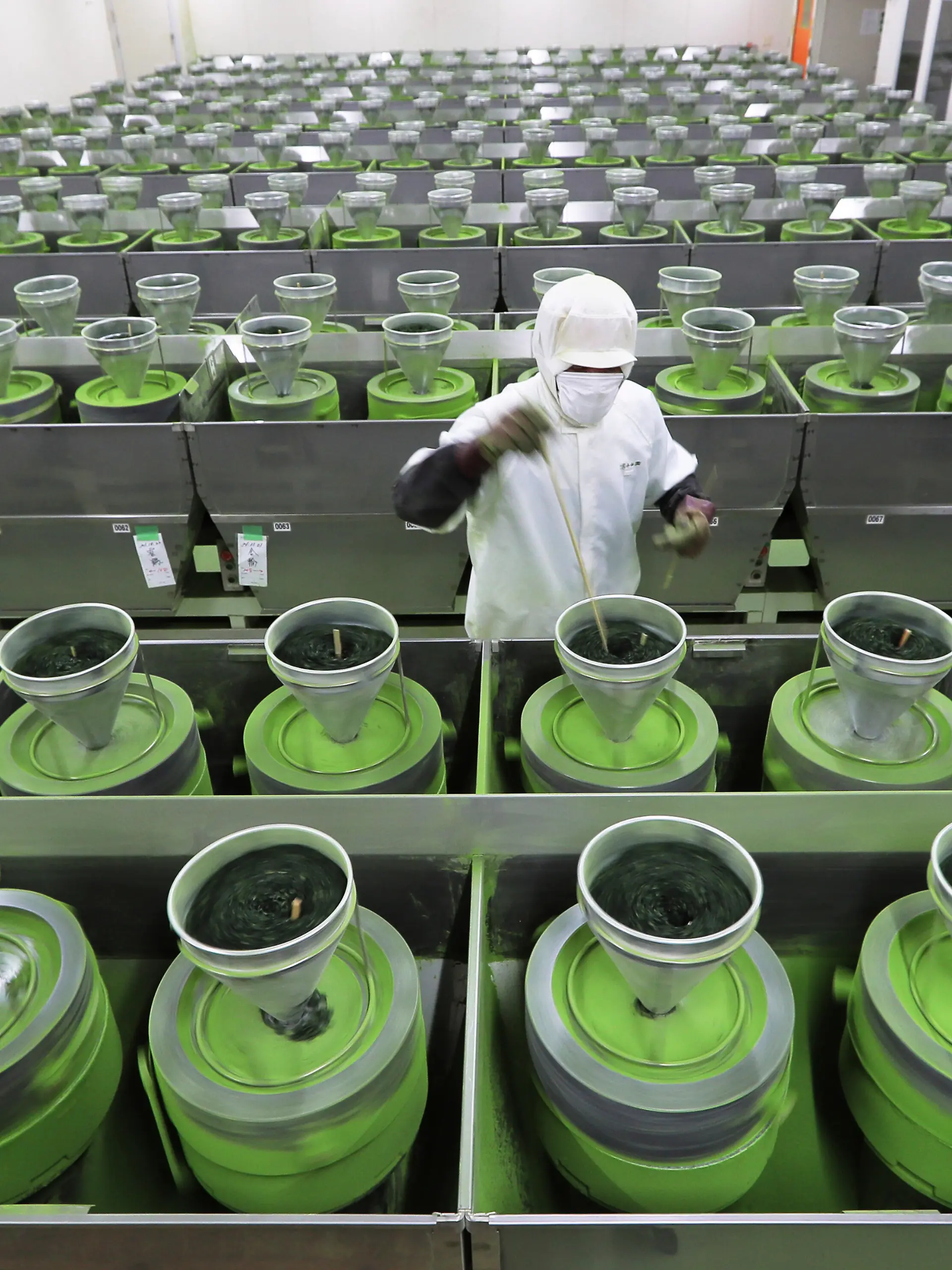 Matcha is made using stone mills at Marukyu Koyamaen, a green tea company, in Uji City, Kyoto Prefecture on Nov. 11, 2021. ( The Yomiuri Shimbun via AP Images )