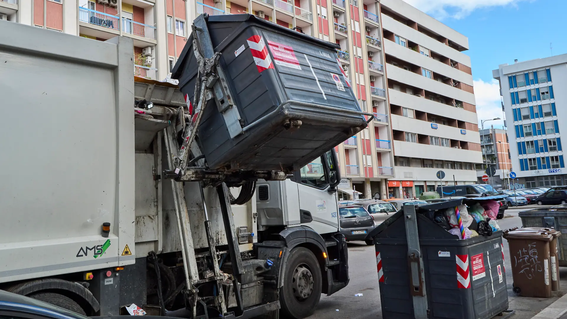 A garbage truck collects unsorted urban waste. The editorial image shows a garbage truck during the automated emptying of a bin containing unsorted municipal solid waste. The photo highlights the waste collection process in urban areas and the importance of efficient waste management systems to maintain city cleanliness and environmental sustainability in Bari, Italy, on October 8, 2025. (Photo by Matteo Della Torre/NurPhoto via Getty Images)