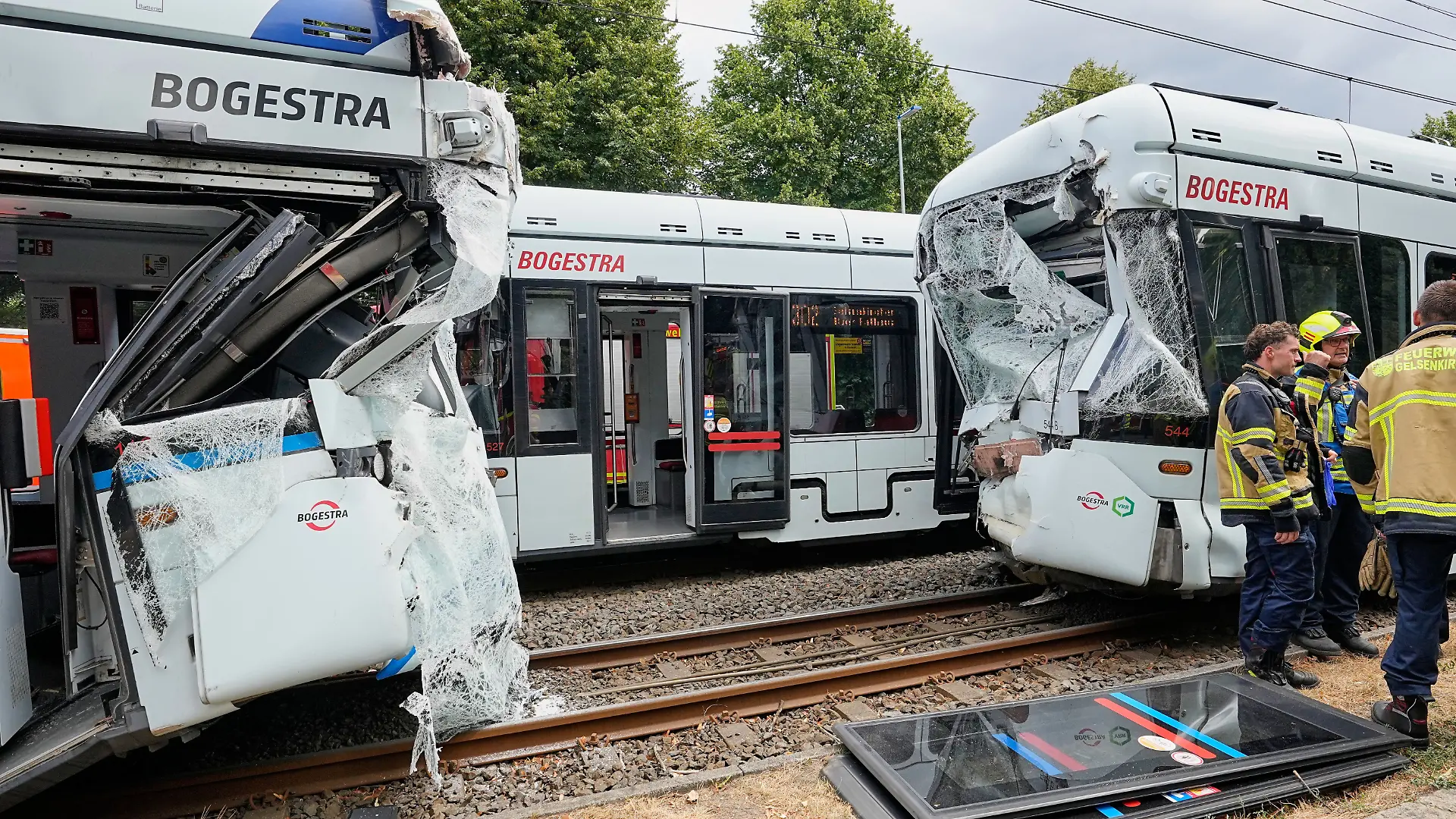 Emergency responders work at the scene of an accident where two trams collided in Gelsenkirchen, Germany, Thursday, Aug. 6, 2026. (AP Photo/Martin Meissner)
