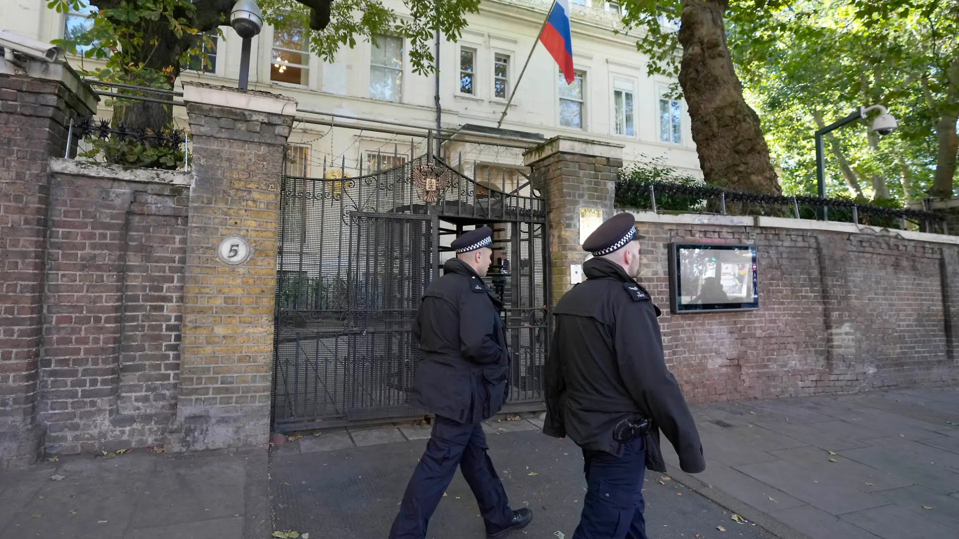 Police officers guard the entrance of the Russian Embassy in London, Friday, Sept. 13, 2024. (AP Photo/Frank Augstein)