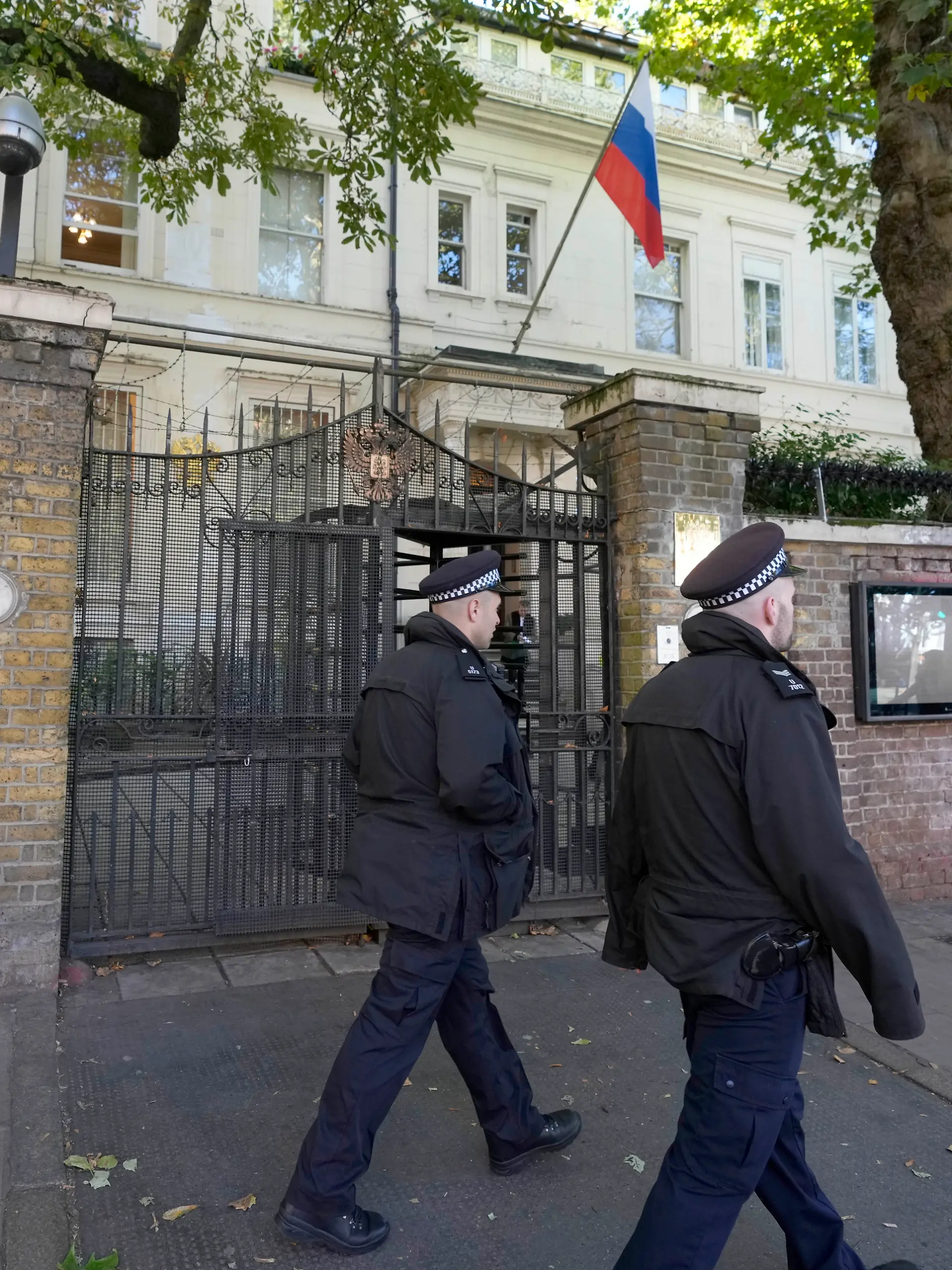 Police officers guard the entrance of the Russian Embassy in London, Friday, Sept. 13, 2024. (AP Photo/Frank Augstein)