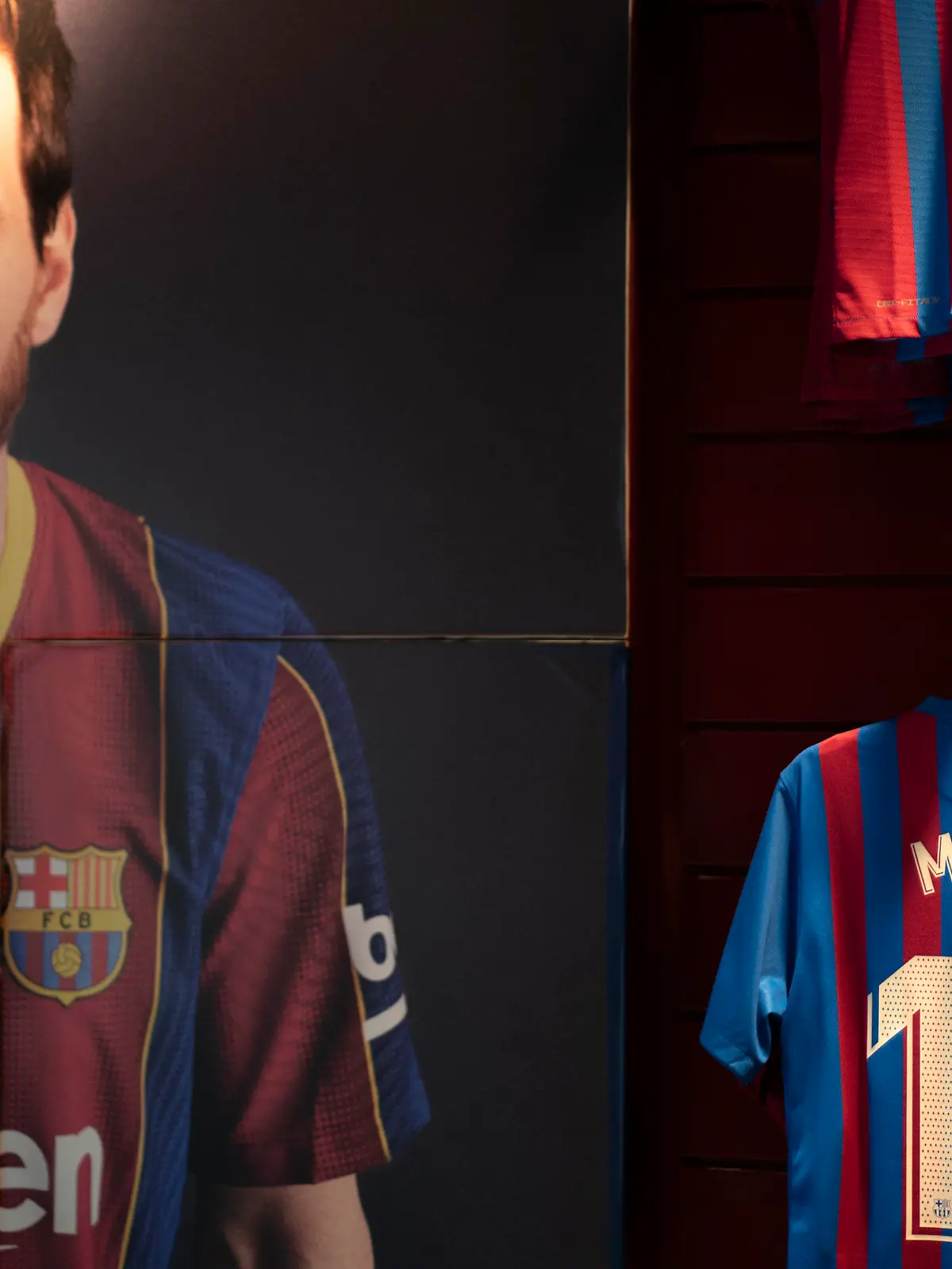 A picture Barcelona soccer player Lionel Messi is exhibited at a F.C Barcelona store in Barcelona, Spain, Thursday, July 1, 2021. Barcelona's poor finances have become the stumbling block to getting Lionel Messi to sign another contract, according to club president Joan Laporta. Messi was officially no longer a Barcelona player on Thursday, following the expiration of his contract. That came 16 years after the forward signed his first profession contract with the club that he joined at age 13.(AP Photo/Joan Mateu)