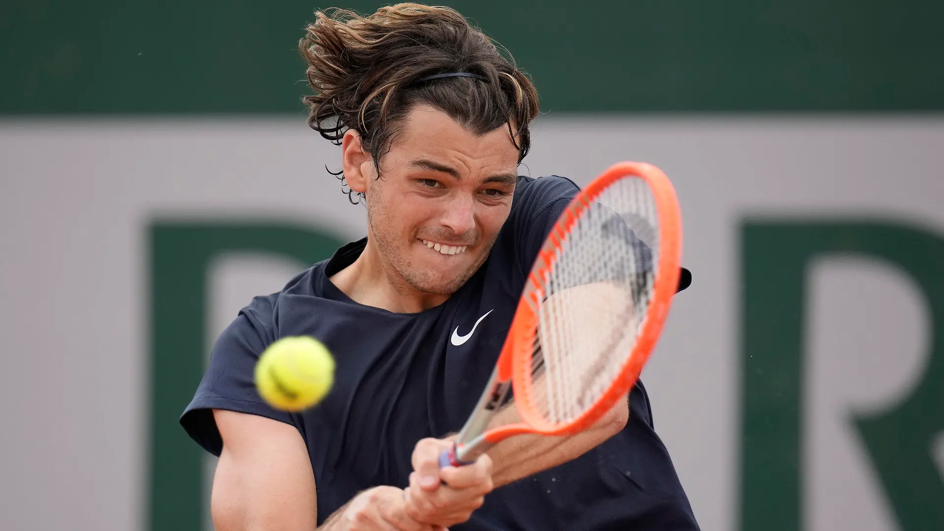 United States's Taylor Fritz plays a return to Germany's Dominik Koepfer during their second round match on day 5, of the French Open tennis tournament at Roland Garros in Paris, France, Thursday, June 3, 2021. (AP Photo/Christophe Ena)