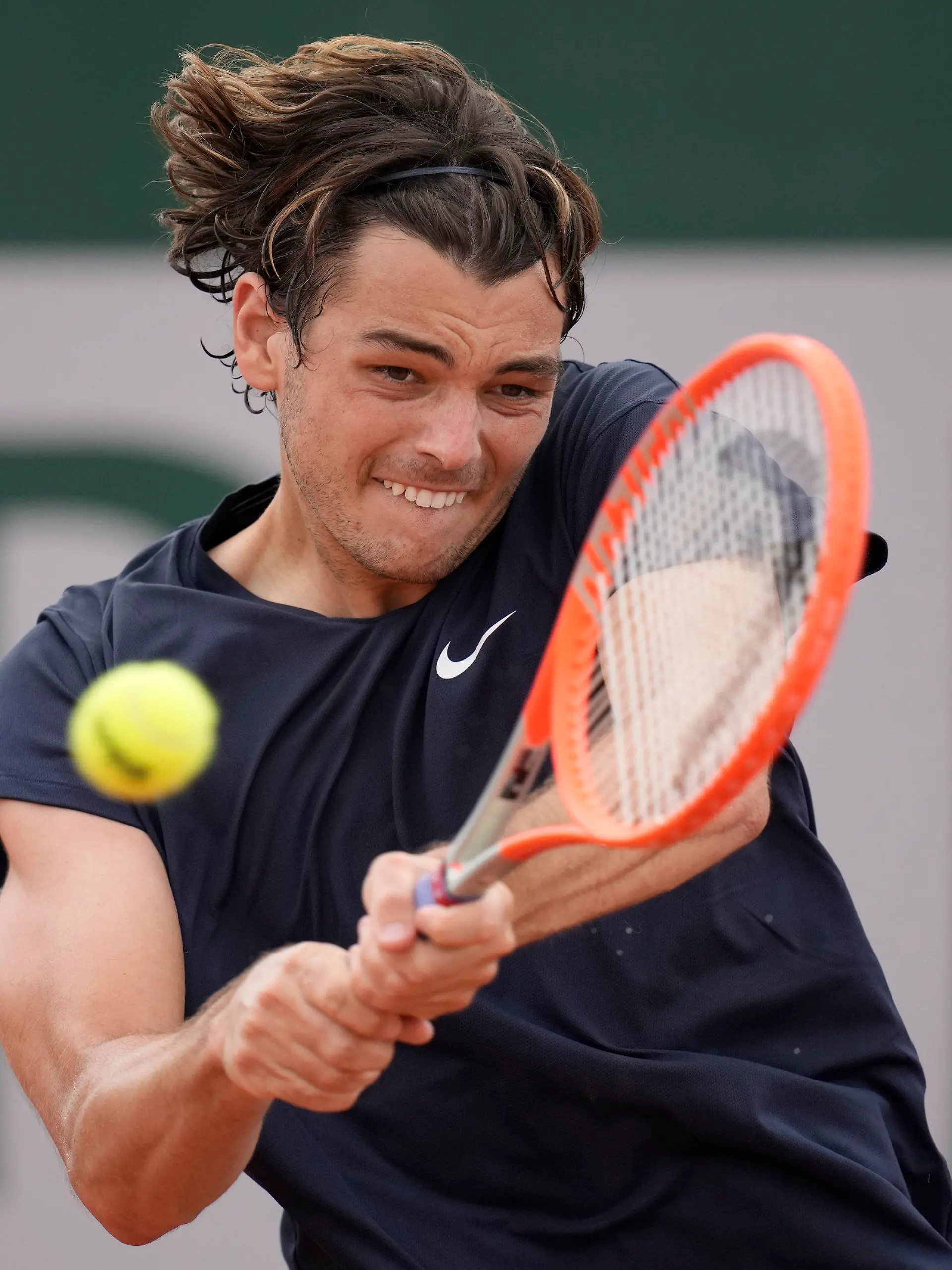 United States's Taylor Fritz plays a return to Germany's Dominik Koepfer during their second round match on day 5, of the French Open tennis tournament at Roland Garros in Paris, France, Thursday, June 3, 2021. (AP Photo/Christophe Ena)