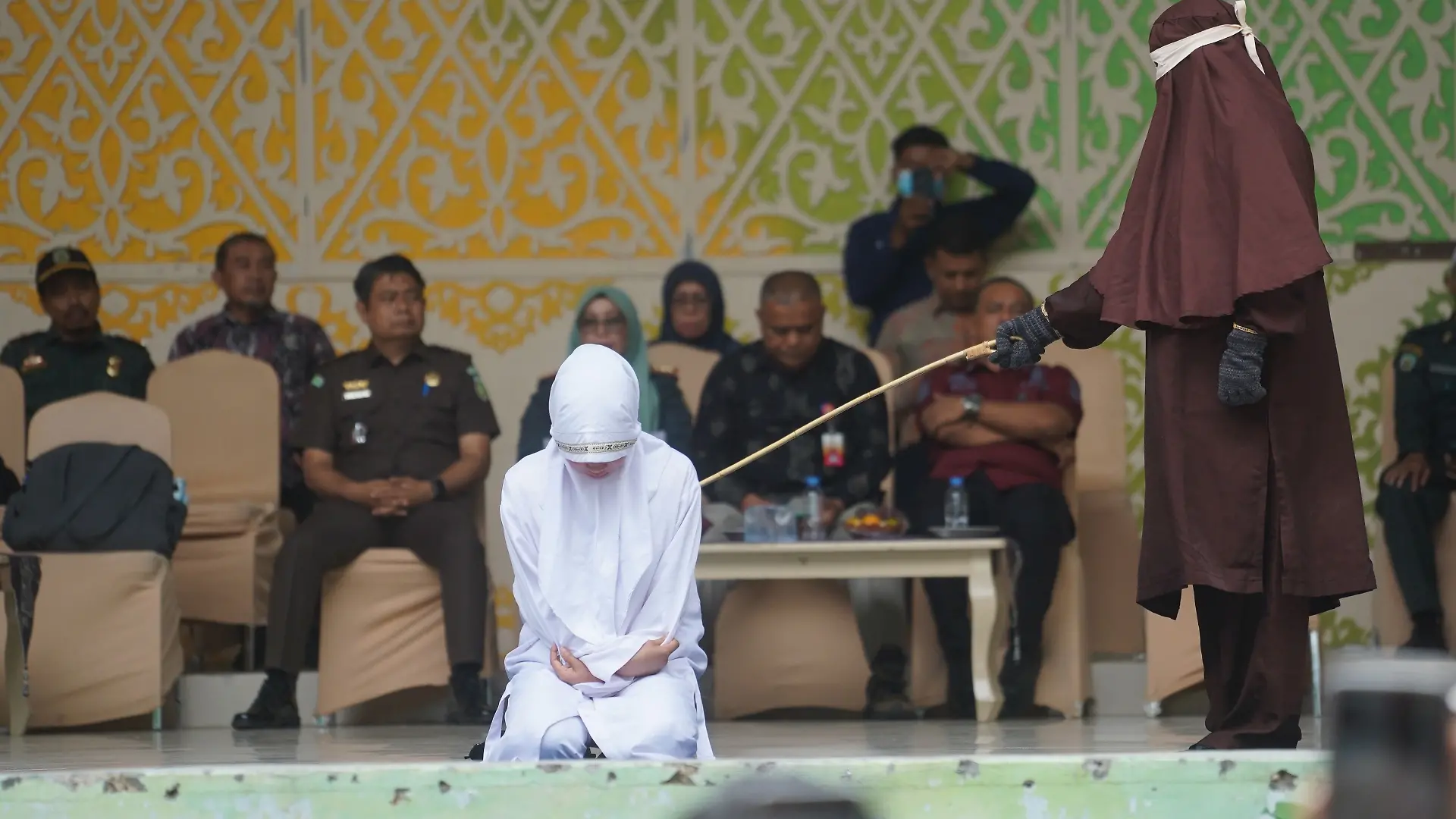 Eleven people convicted under Aceh's Qanun on Islamic Criminal Law (Jinayat) receive caning sentences at the Taman Sari Bustanussalatin Stage in Banda Aceh. The sentences are carried out in public as part of the court-ordered punishment. Where: Banda Aceh, Indonesia When: 20 Aug 2026 Credit: Cyeh/JNA Press/Cover Images