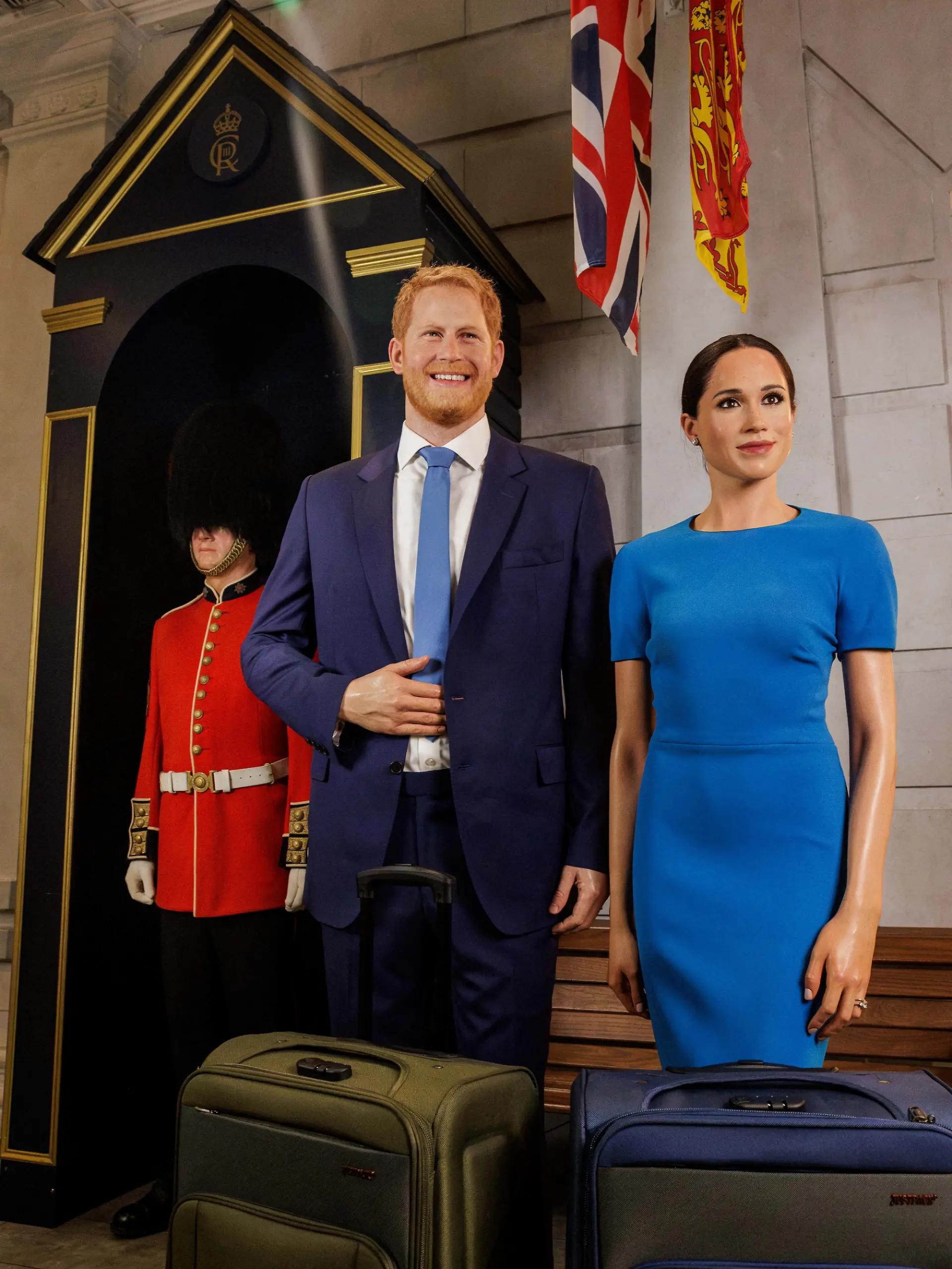 The waxworks of Britain's Prince Harry and his wife, Meghan, stand next to suitcases at the Madame Tussauds museum, in London, Britain, in this handout released August 20, 2026.  Madame Tussauds London/Handout via REUTERS    THIS IMAGE HAS BEEN SUPPLIED BY A THIRD PARTY. NO RESALES. NO ARCHIVES