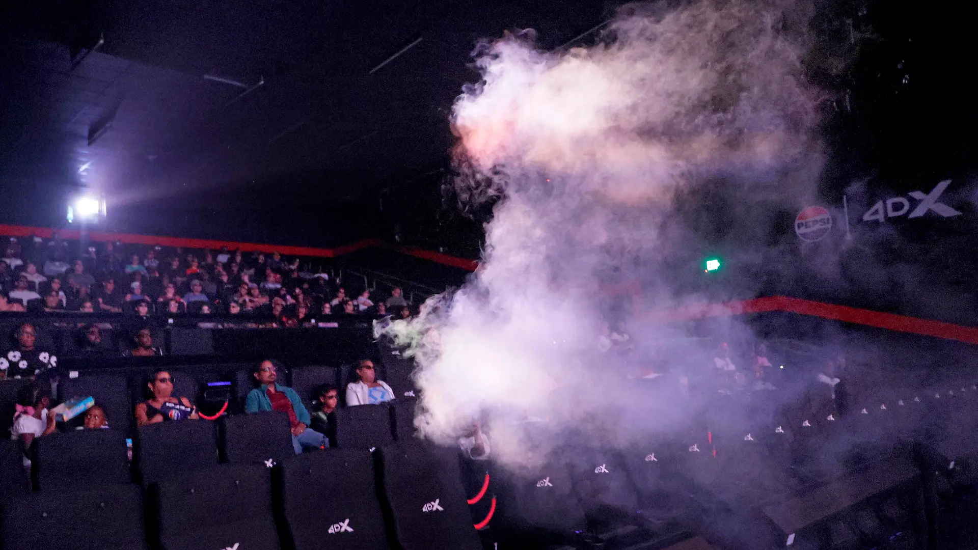 A smoke machine releases a burst of fog over moviegoers seated in a 4DX auditorium at Regal Sawgrass in Sunrise, Florida, on August 8, 2026. The special-effects experience, which includes motion seats, water, wind and atmospheric fog, was part of a screening of "Spider-Man: Brand New Day" at the Broward County theater. (Photo by Mike Stocker/South Florida Sun-Sentinel/TNS/Sipa USA)