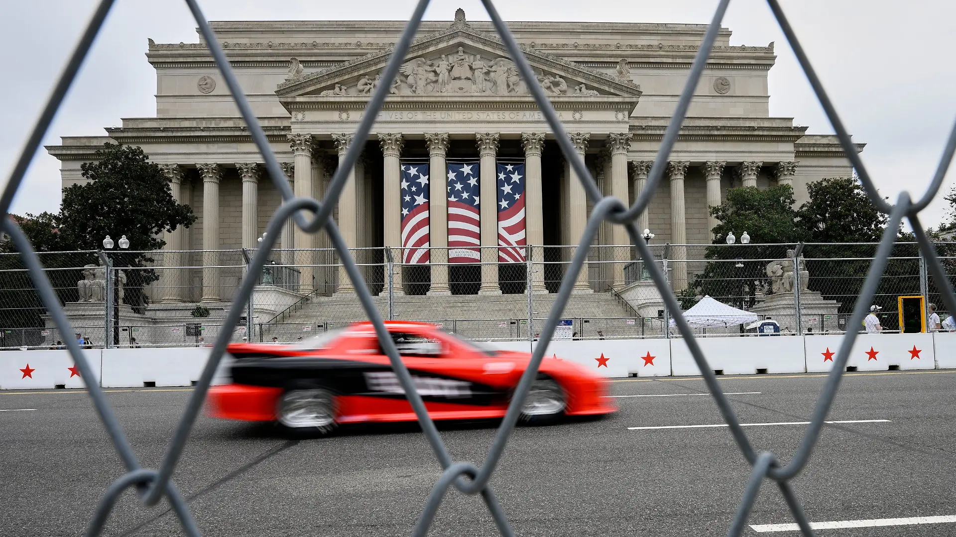 IROC cars drive past the National Archives building, prior to Sunday's Freedom 250 Grand Prix auto race in Washington, Saturday, Aug. 22, 2026. (AP Photo/Nick Wass)