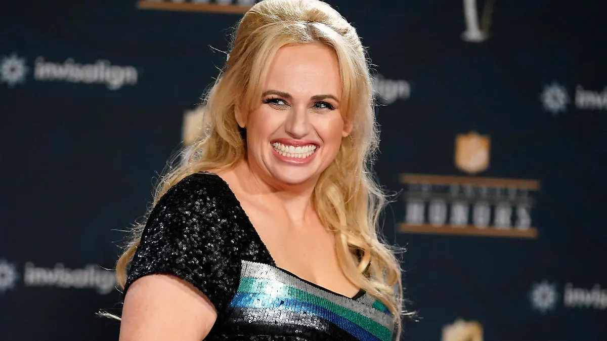 FILE - In this Tuesday, Feb. 2, 2021, file photo, Rebel Wilson poses on the red carpet during the NFL Honors football awards show, in Los Angeles. Wilson returns to her roots as host of ABC's “Pooch Perfect,” an eight-episode series featuring 10 dog groomers and their assistants competing in challenges. The show, which debuts March 30, is based on an Australian version. (AP Photo/Marcio Jose Sanchez, File)