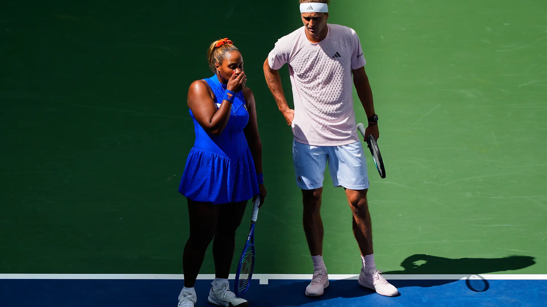 Taylor Townsend, of the United States, left, and Alexander Zverev, of Germany, talk on the court during a mixed doubles match at the U.S. Open tennis championships, Tuesday, Aug. 25, 2026, in New York. (AP Photo/Yuki Iwamura)
