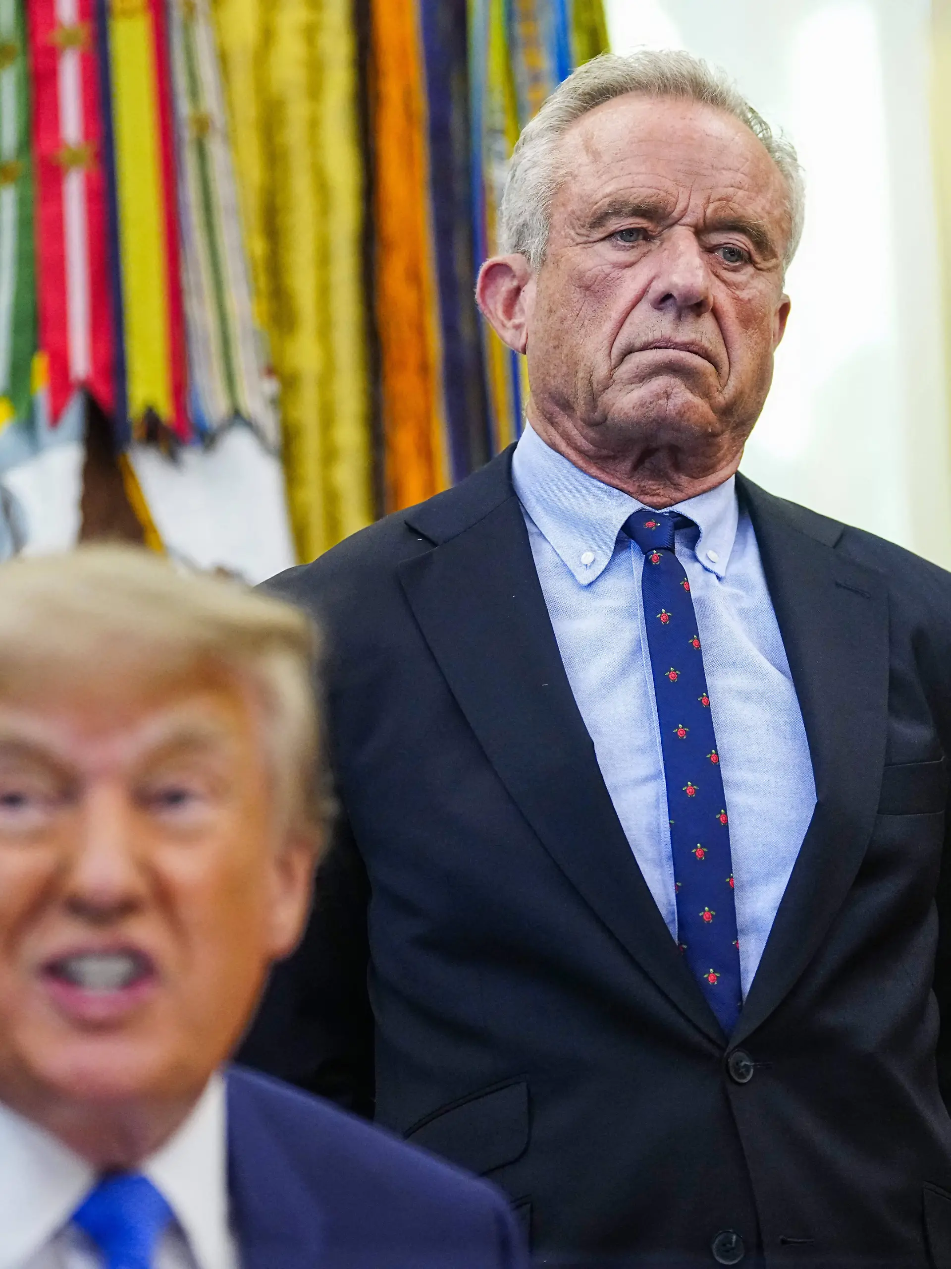 President Donald Trump Signs Executive Order on Childhood Vaccines US Health and Human Services Secretary Robert F. Kennedy Jr. R looks on as President Donald Trump L speaks before signing an executive order that reevaluates childhood vaccines in the Oval Office of the White House in Washington, DC on August 10, 2026. While the executive order still recommends childhood vaccines for 11 diseases, including measles and polio, it calls for limiting vaccines for other diseases, like hepatitis A and B and meningococcal disease, to high-risk populations. Photo by Bonnie Cash/Pool/ABACAPRESS.COM WASHINGTON DC United States PUBLICATIONxNOTxINxFRAxUK Copyright: xPool/ABACAx