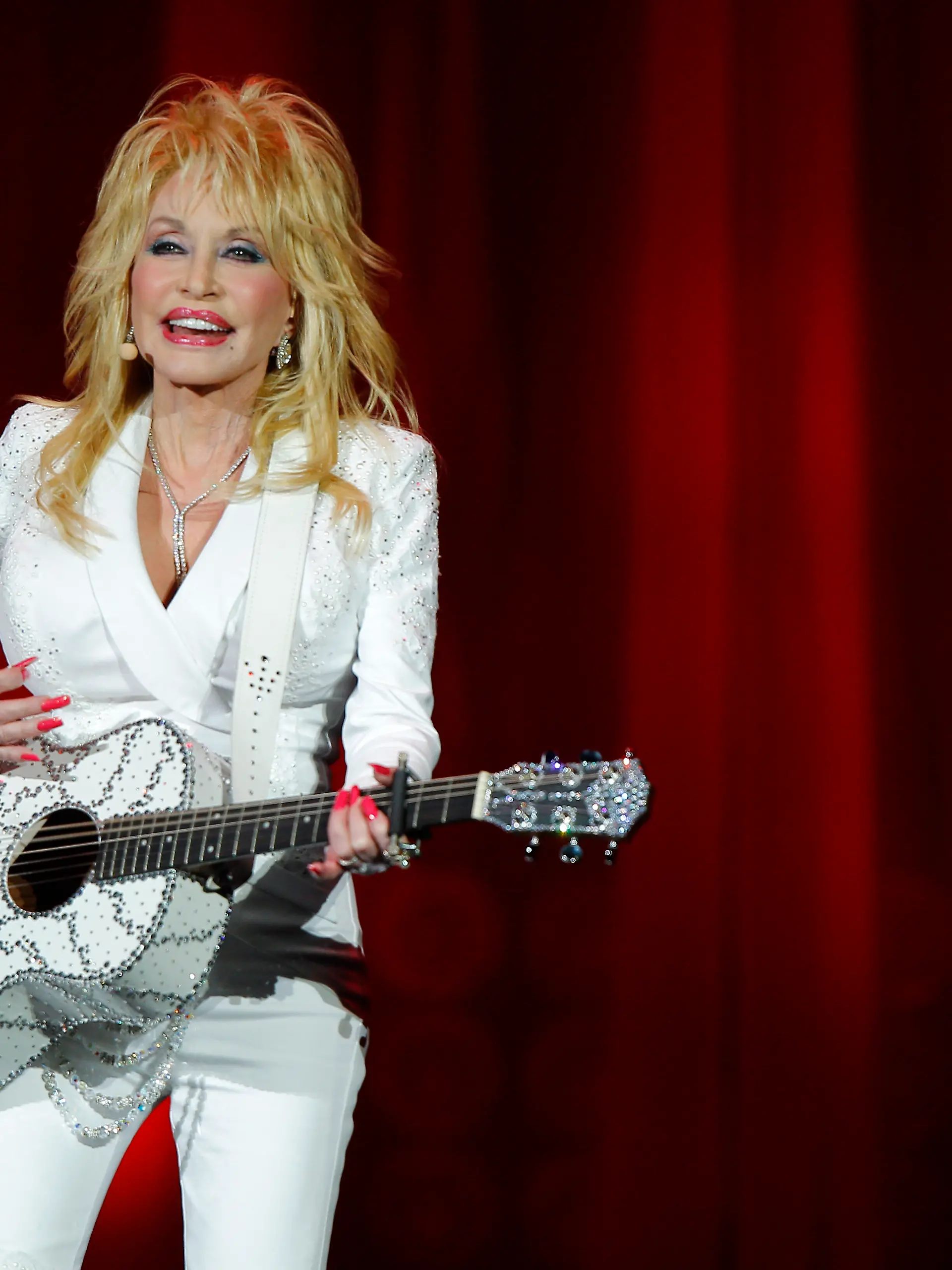 Dolly Parton is seen performing in concert at the Ryman Auditorium on Friday, July 31, 2015 in Nashville, Tenn. (Photo by Wade Payne/Invision/AP)