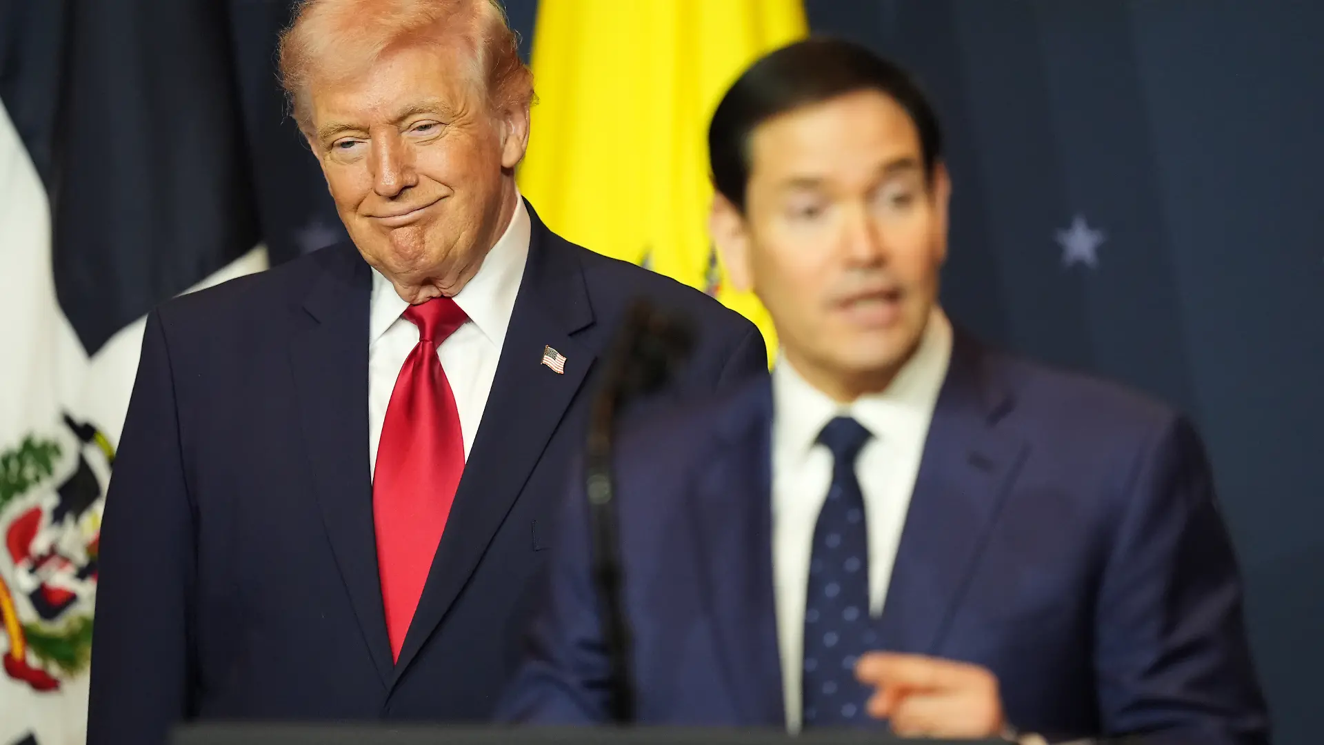 President Donald Trump listens while Secretary of State Marco Rubio speaks at the Shield of the Americas Summit, Saturday, March 7, 2026, at Trump National Doral Miami in Doral, Fla. (AP Photo/Rebecca Blackwell)
