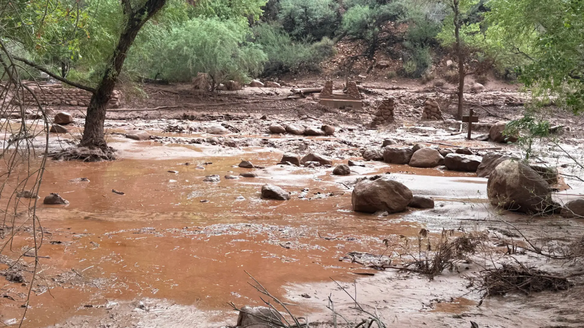 This photo provided by the National Park Service shows remnants of stone bridge pylons along Bright Angel Creek in the Grand Canyon following a flash flood that destroyed the footbridge, Saturday, Aug. 29, 2026. (James Thompson/National Park Service via AP)