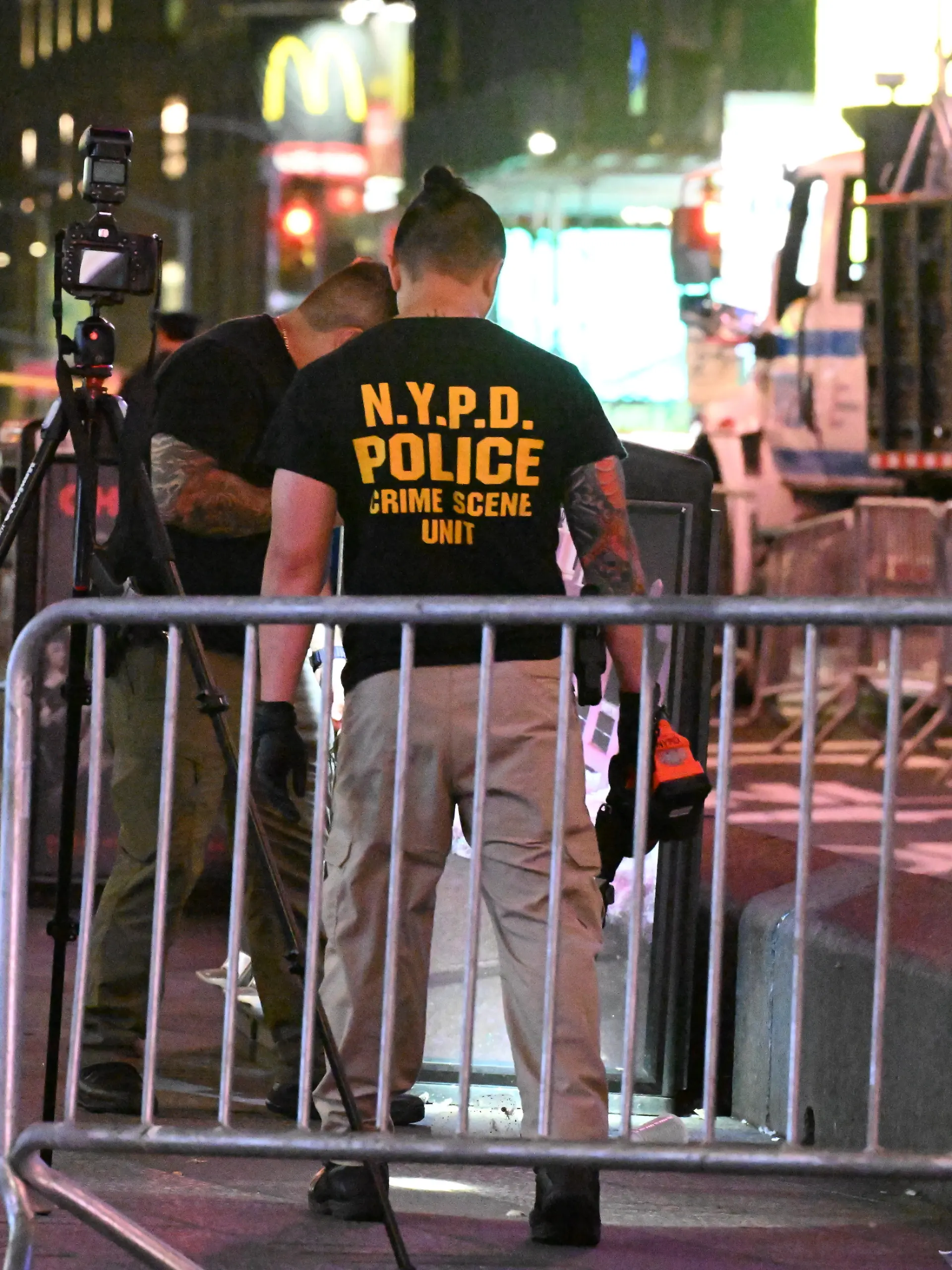 Crime scene unit investigators place down evidence markers near blood and shell casings at the scene after NYPD officers shot and killed a knife-wielding woman who fatally stabbed a woman and injured a man in Times Square near the area of West 42nd Street and 7th Avenue in Times Square, Manhattan, New York, United States on Monday, August 31, 2026. A knife-wielding woman was shot and killed by police in the heart of Times Square after she stabbed two people, killing one person Monday. The suspect knifed a man and a woman at West 42nd Street and Seventh Avenue in the Crossroads of the World just before 4:30 p.m.. The suspect and the two people who were stabbed were all hospitalized in critical condition. The woman who was stabbed was pronounced dead and the man who was stabbed is in stable condition. The investigation by the NYPD is ongoing and active at this time. Several knives were recovered at the scene. (Photo by Kyle Mazza/Sipa USA)