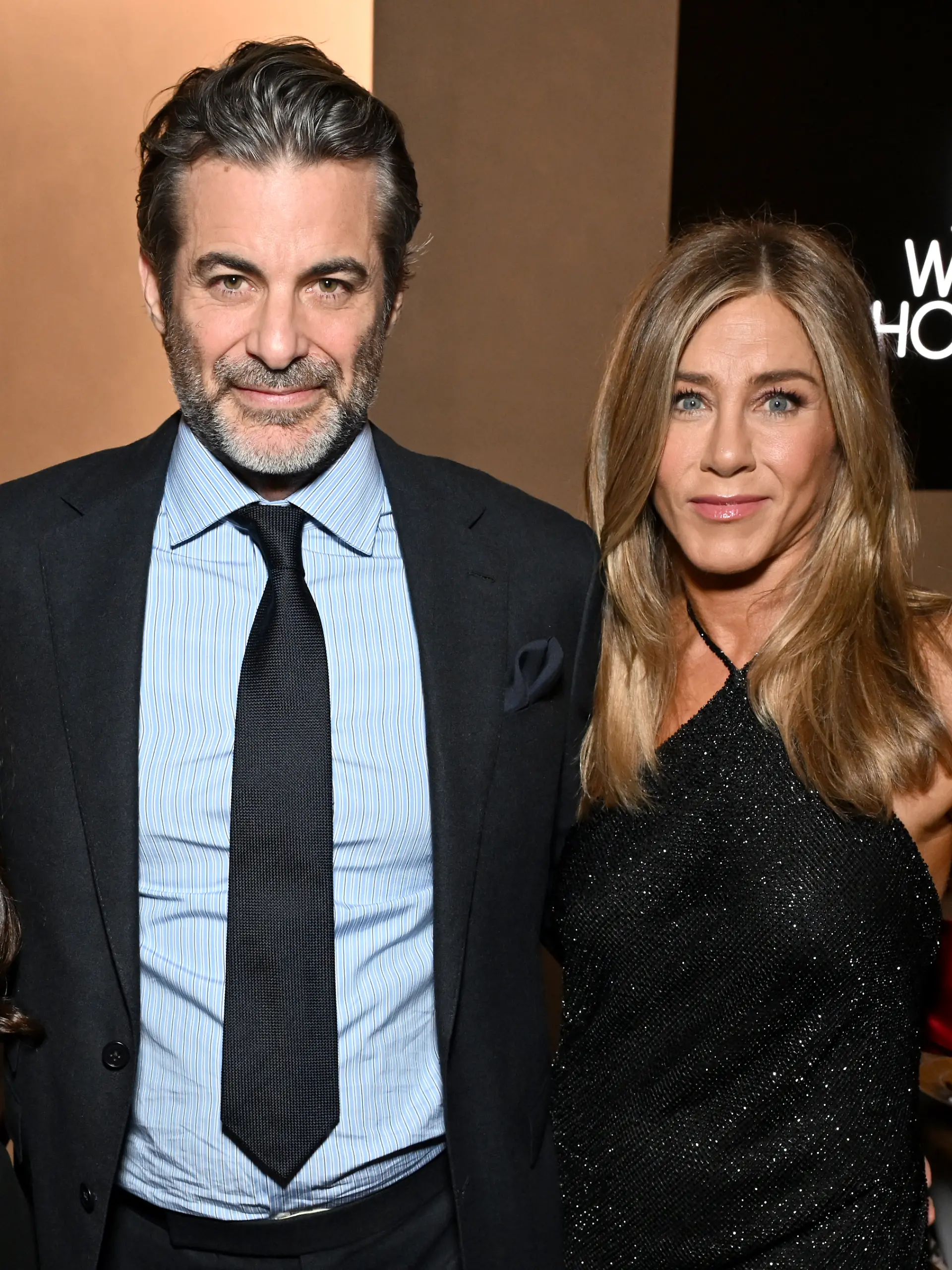 LOS ANGELES, CALIFORNIA - NOVEMBER 17: (L-R) Jim Curtis and Jennifer Aniston, wearing Ralph Lauren, attend ELLE's 2025 Women in Hollywood Celebration presented by Ralph Lauren and Bvlgari with support from evian, Hendrick's Gin, and Lucid Motors on November 17, 2025 in Los Angeles, California. (Photo by Michael Kovac/Getty Images for ELLE)