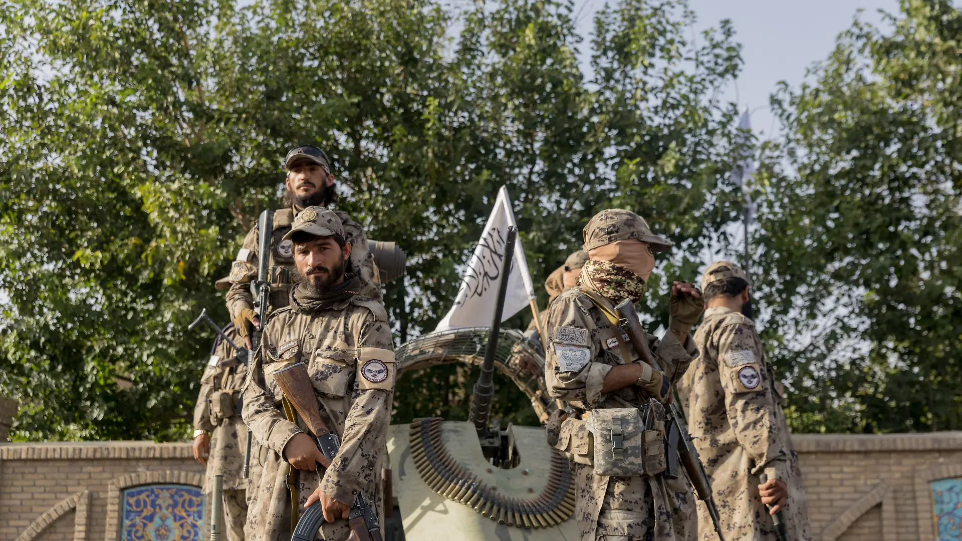Armed Taliban fighters stand on a military vehicle during celebrations for the fifth anniversary of the Taliban's takeover in Herat, Afghanistan, on August 15, 2026. The nationwide holiday marks the collapse of the previous government and the withdrawal of international forces in 2021.//MIDDLEEASTIMAGES_MEI-AFG-MANI-TFACHJ-20260815-0028/Credit:Mustafa Noori/MEI/SIPA/2608160935