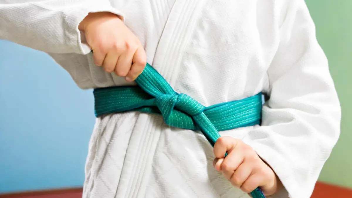 young boy preparing to perform judo