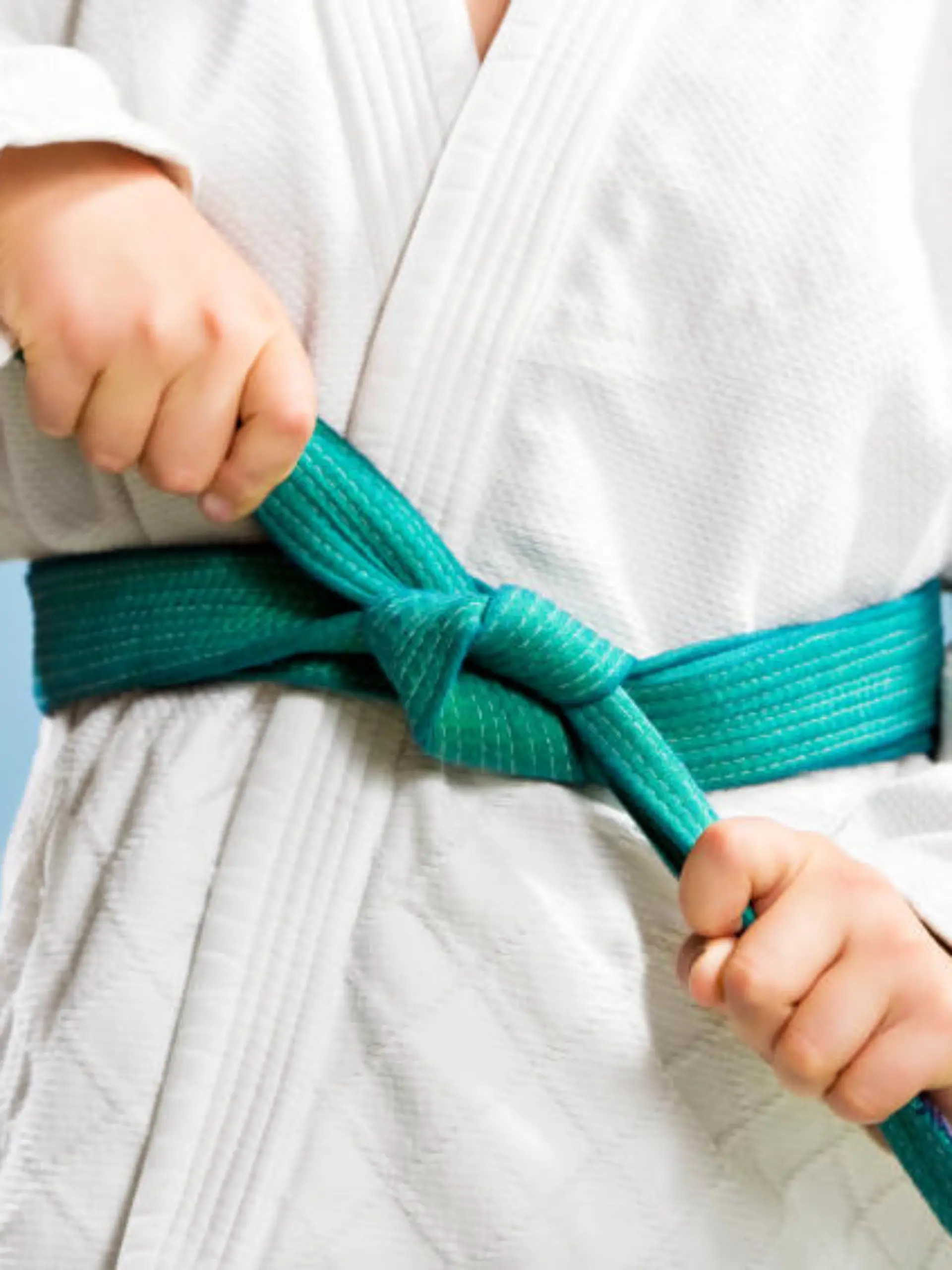 young boy preparing to perform judo