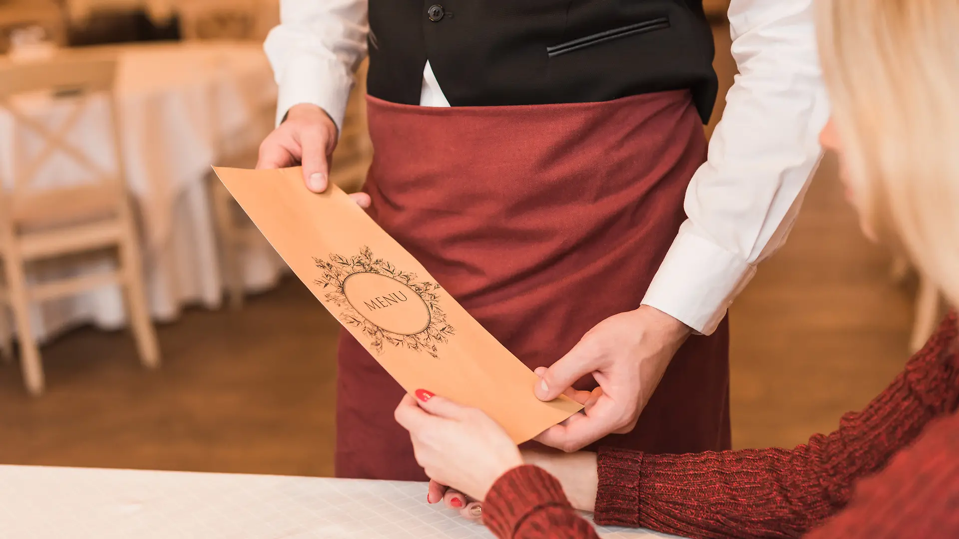 Waiter giving menu
