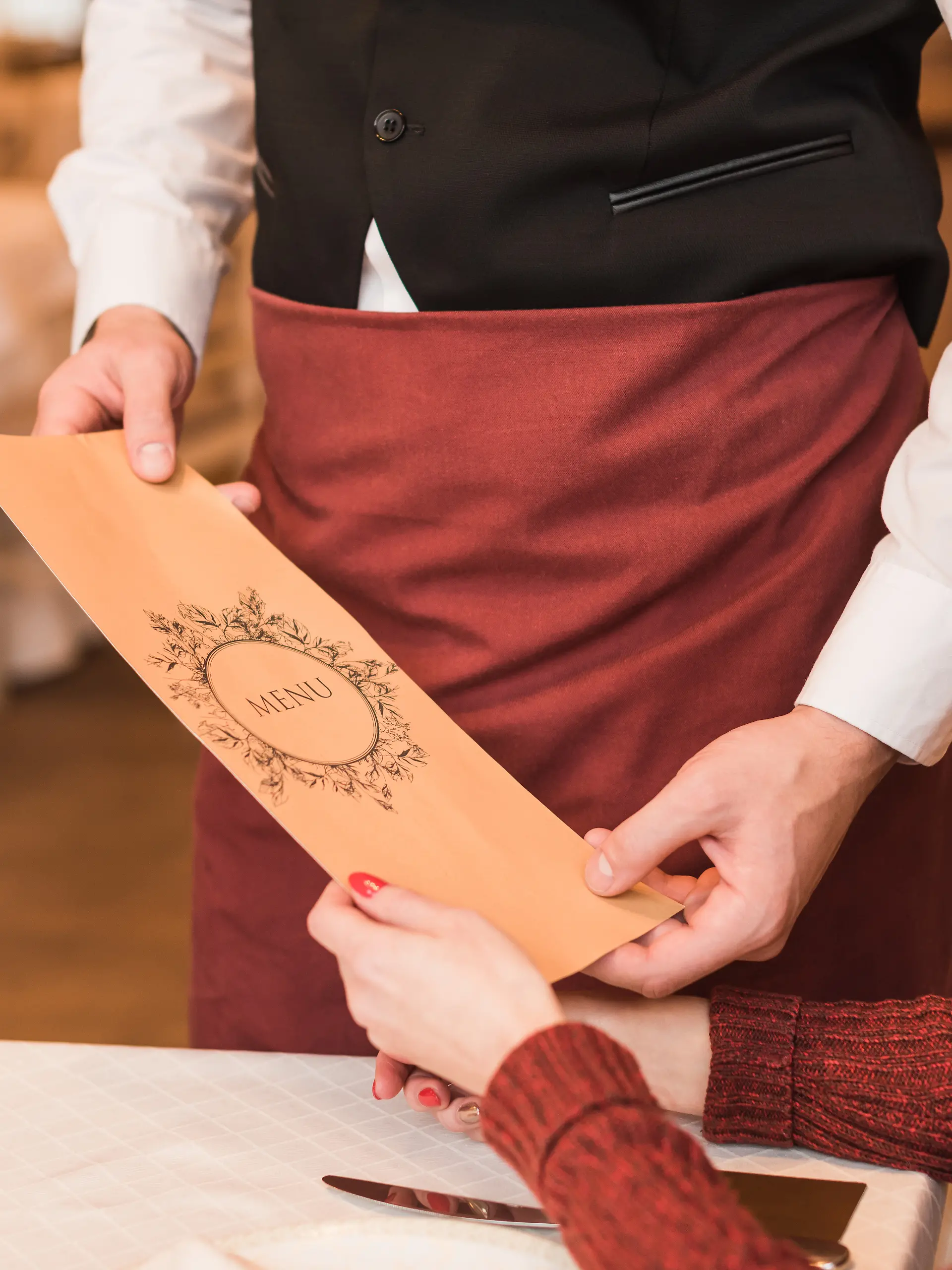 Waiter giving menu
