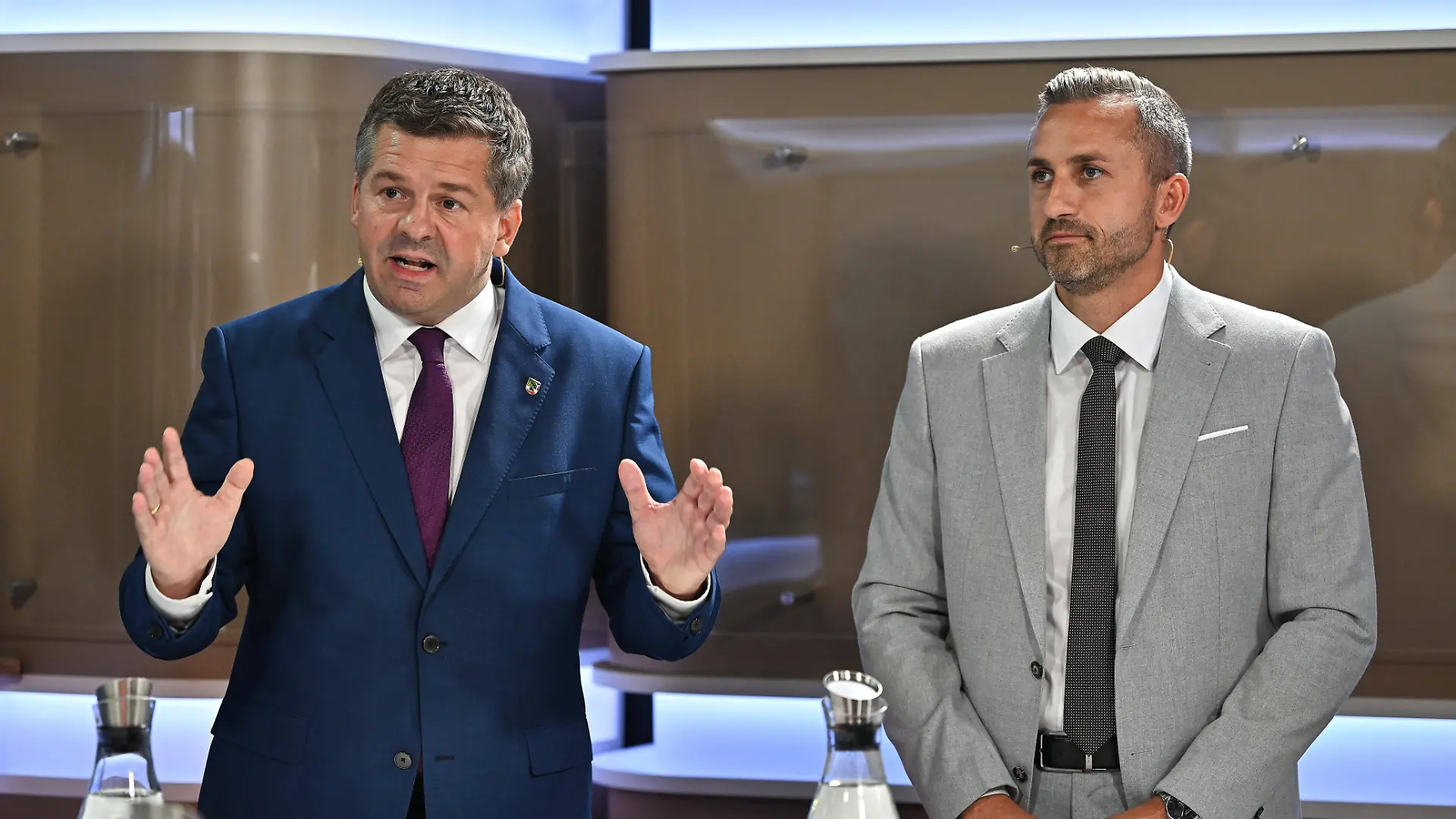 Ministerpräsident Sven Schulze (CDU) und der AfD-Herausforderer Ulrich Siegmund