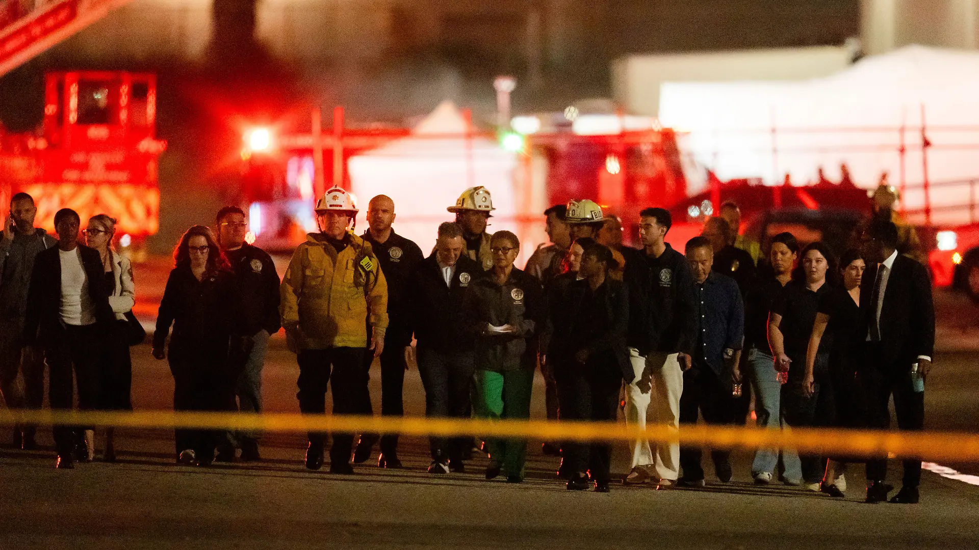 Los Angeles Mayor Karen Bass joined by other officials walk to a news conference near the scene of a helicopter crash in Chatsworth, a neighborhood in Los Angeles, Tuesday, Sept. 15, 2026. (AP Photo/Ethan Swope)