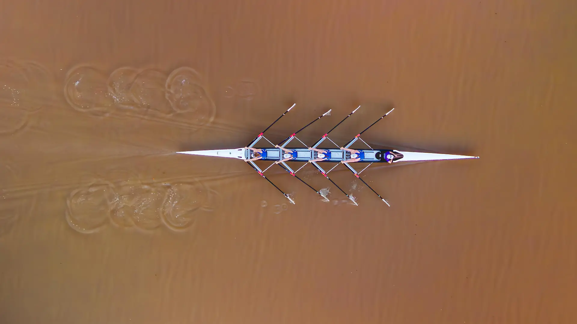 In this photo provided by the Rockhampton Regional Council, rowers paddle on the Fitzroy River at Rockhampton, Australia, on July 24, 2025. (Rockhampton Regional Council via AP)