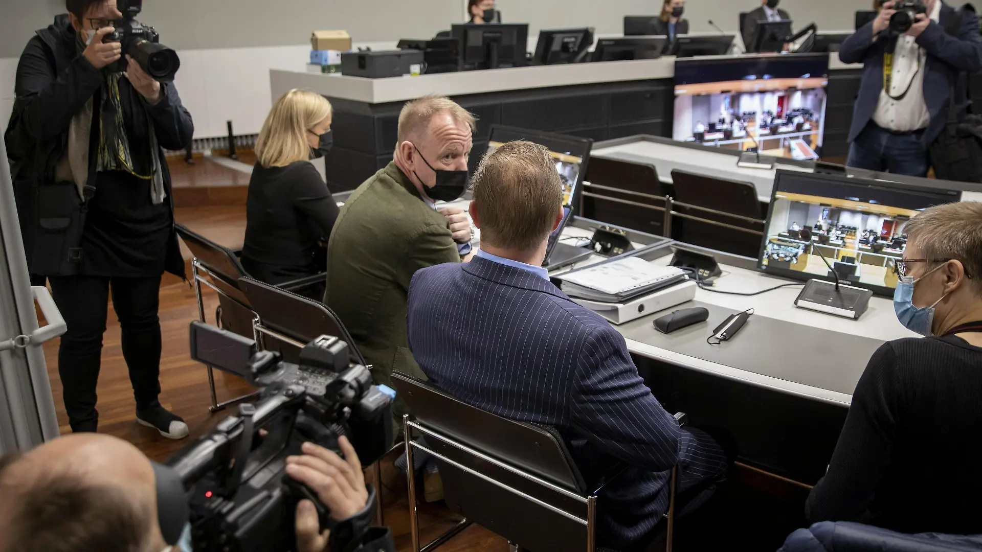 The trial of a Danish man (blue suit) who is suspected of murder and attempted murder of a German couple aboard the Viking Sally ferry in the summer of 1987 started at the Southwest district court in Turku, Finland, May 24, 2021. The court acquitted the defendant on June 30, 2021. According to the verdict the allegations did not provide sufficient evidence. Twenty-year-old Klaus Schelkle died in the attack while his 22-year-old girlfriend, Bettina Taxis, sustained serious injuries. Danish boy scouts were the first to discover the victims. Prosecutors have filed homicide charges against the Danish man born in 1969. The defendant has denied the charges. Lehtikuva/Roni Lehti via REUTERS THIS IMAGE HAS BEEN SUPPLIED BY A THIRD PARTY. FINLAND OUT. NO COMMERCIAL OR EDITORIAL SALES IN FINLAND. NO THIRD PARTY SALES. NOT FOR USE BY REUTERS THIRD PARTY DISTRIBUTORS. EDITORS NOTE: Finnish News Agency STT does not publish the name or picture of the accused
