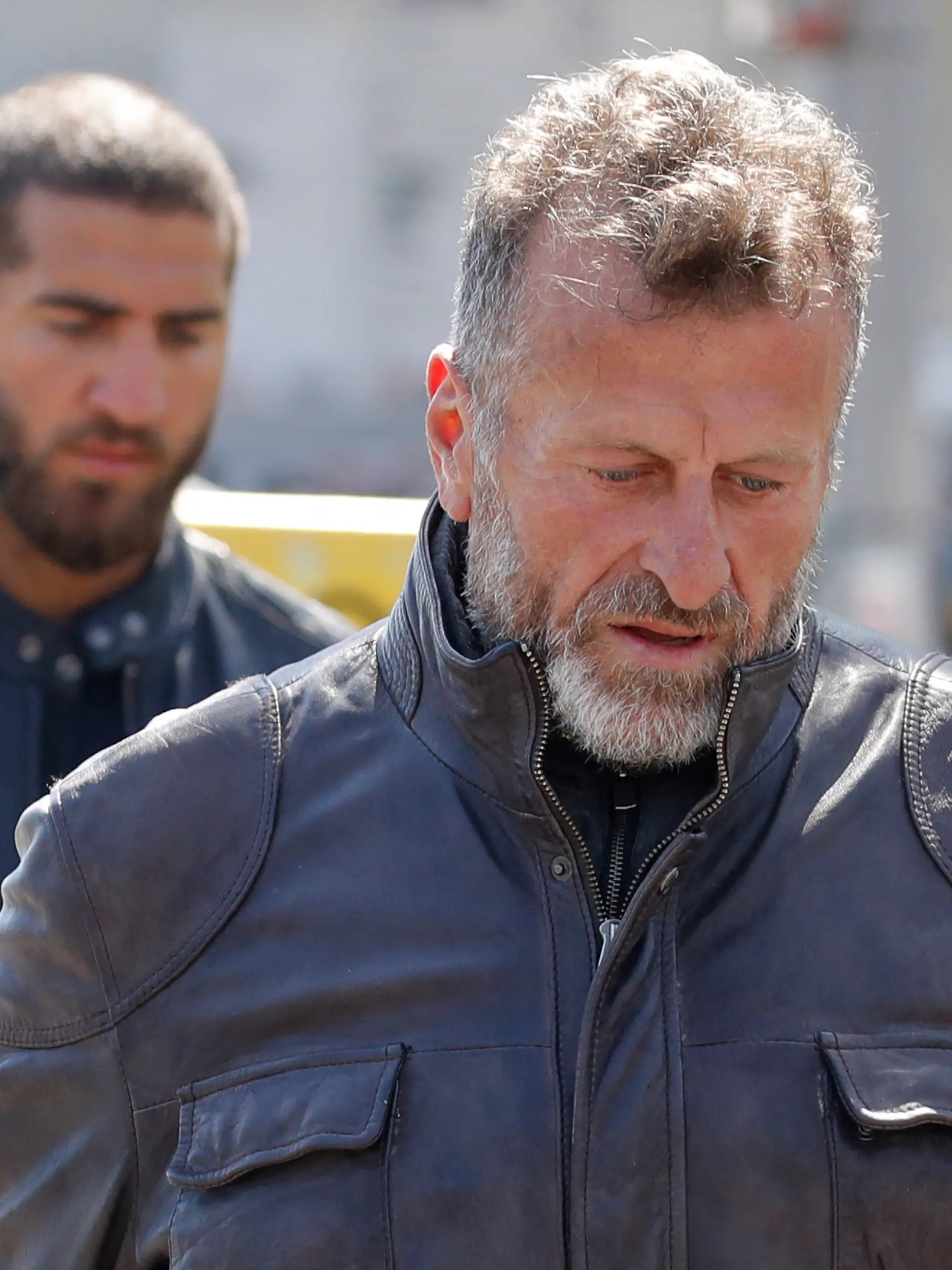 Issa Remmo (R), chief of the Remmo-Clan, arrives for the funeral of his mother at the Zwoelf-Apostel-Friedhof cemetery in Berlin's Schoeneberg district, on April 27, 2020, as access to funerals is limited due to the novel coronavirus. The Remmo-Clan (also known as Rammo-Clan) is a family of Arab origin notorious for ties to organised crime. The mother of Issa Remmo, chief of the clan, died on April 23, 2020 in a Berlin hospital. Hundreds of mourning family and clan members were expectd for the funeral, although only 20 persons are allowed to attend funerals in the German capital in a social distancing measure to limit the spread of the novel coronavirus. (Photo by Odd ANDERSEN / AFP)