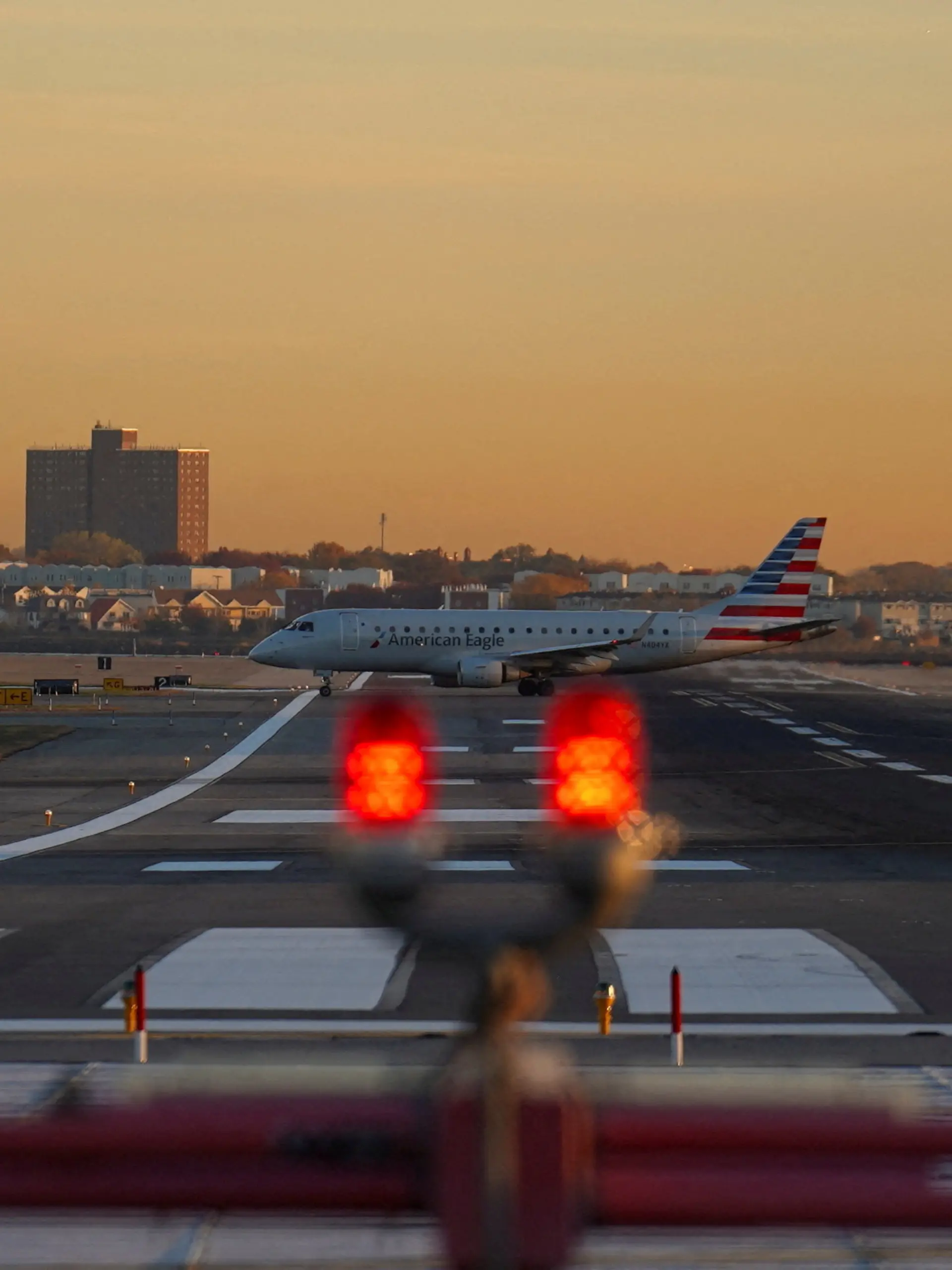 FILE PHOTO: An American Airlines airplane taxis on the tarmac at New York's Laguardia Airport after the FAA ordered flight cuts at 40 major airports amid the ongoing U.S. government shutdown in the Queens borough of New York City, U.S., November 7, 2025. REUTERS/Ryan Murphy/File Photo