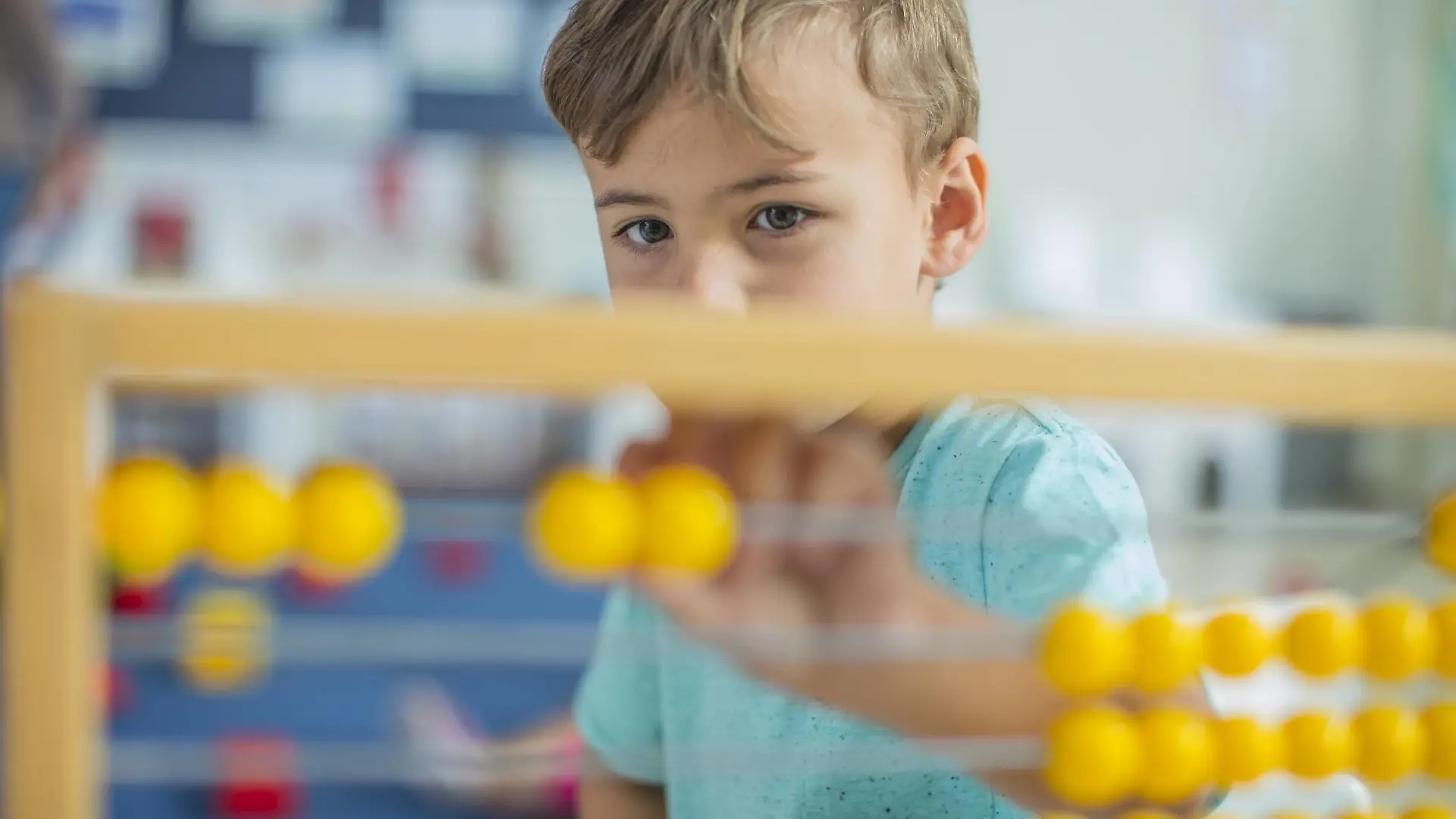 Boy in kindergarten using abacus model released Symbolfoto property released PUBLICATIONxINxGERxSUIxAUTxHUNxONLY ZEF15446