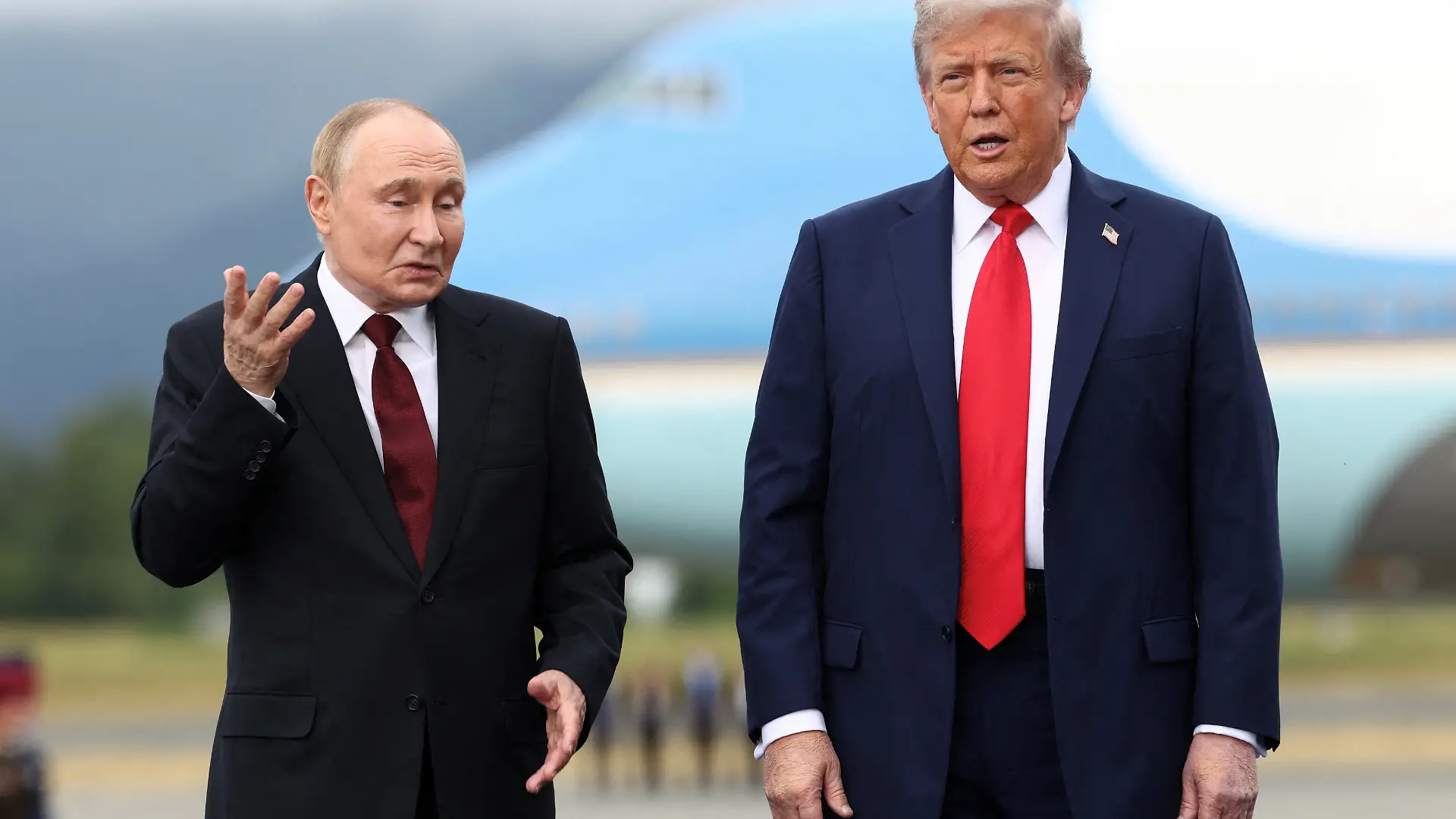 U.S. President Donald Trump stands with Russian President Vladimir Putin, as they meet to negotiate for an end to the war in Ukraine, at Joint Base Elmendorf-Richardson in Anchorage, Alaska, U.S., August 15, 2025. REUTERS/Kevin Lamarque