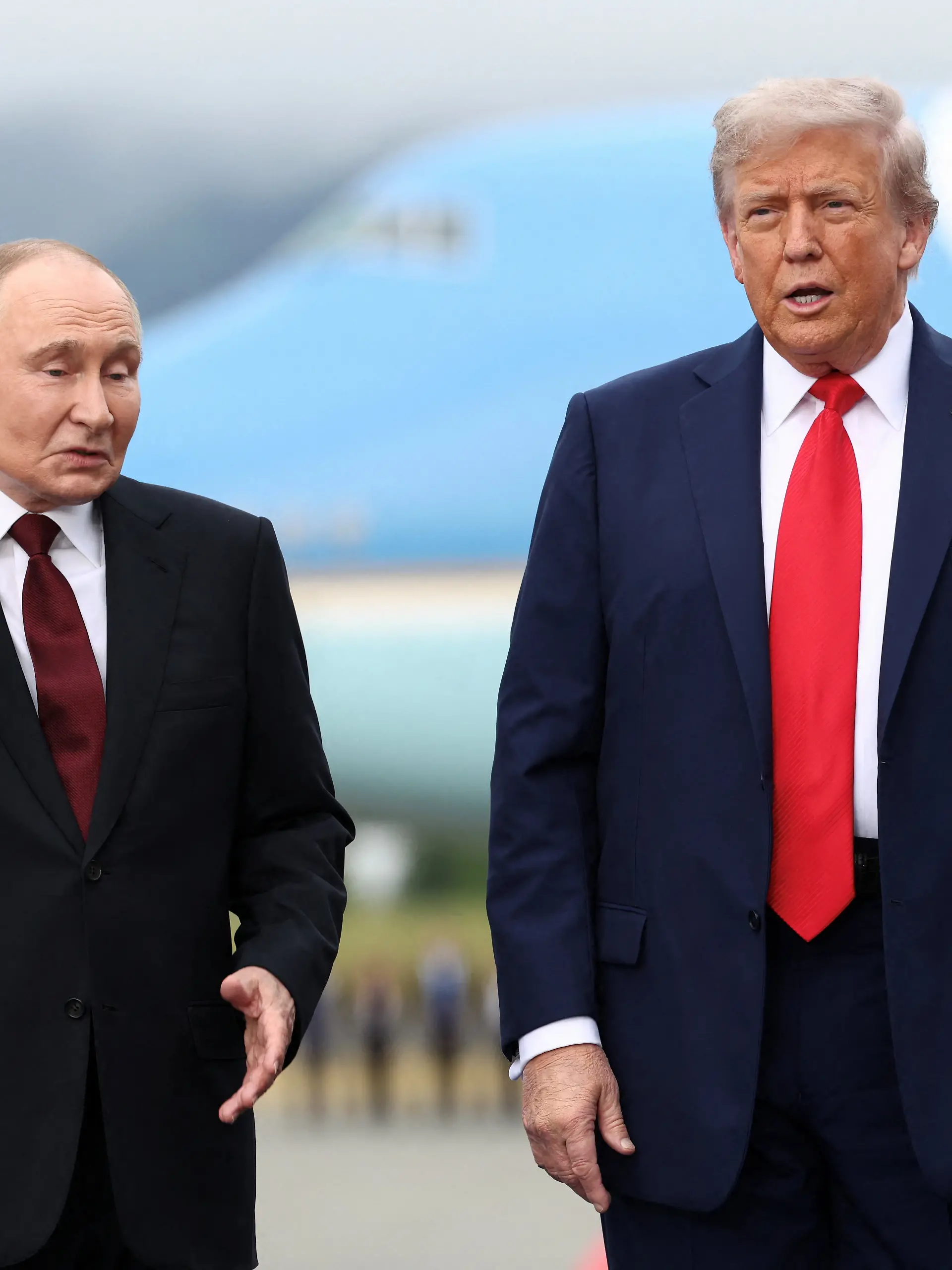 U.S. President Donald Trump stands with Russian President Vladimir Putin, as they meet to negotiate for an end to the war in Ukraine, at Joint Base Elmendorf-Richardson in Anchorage, Alaska, U.S., August 15, 2025. REUTERS/Kevin Lamarque