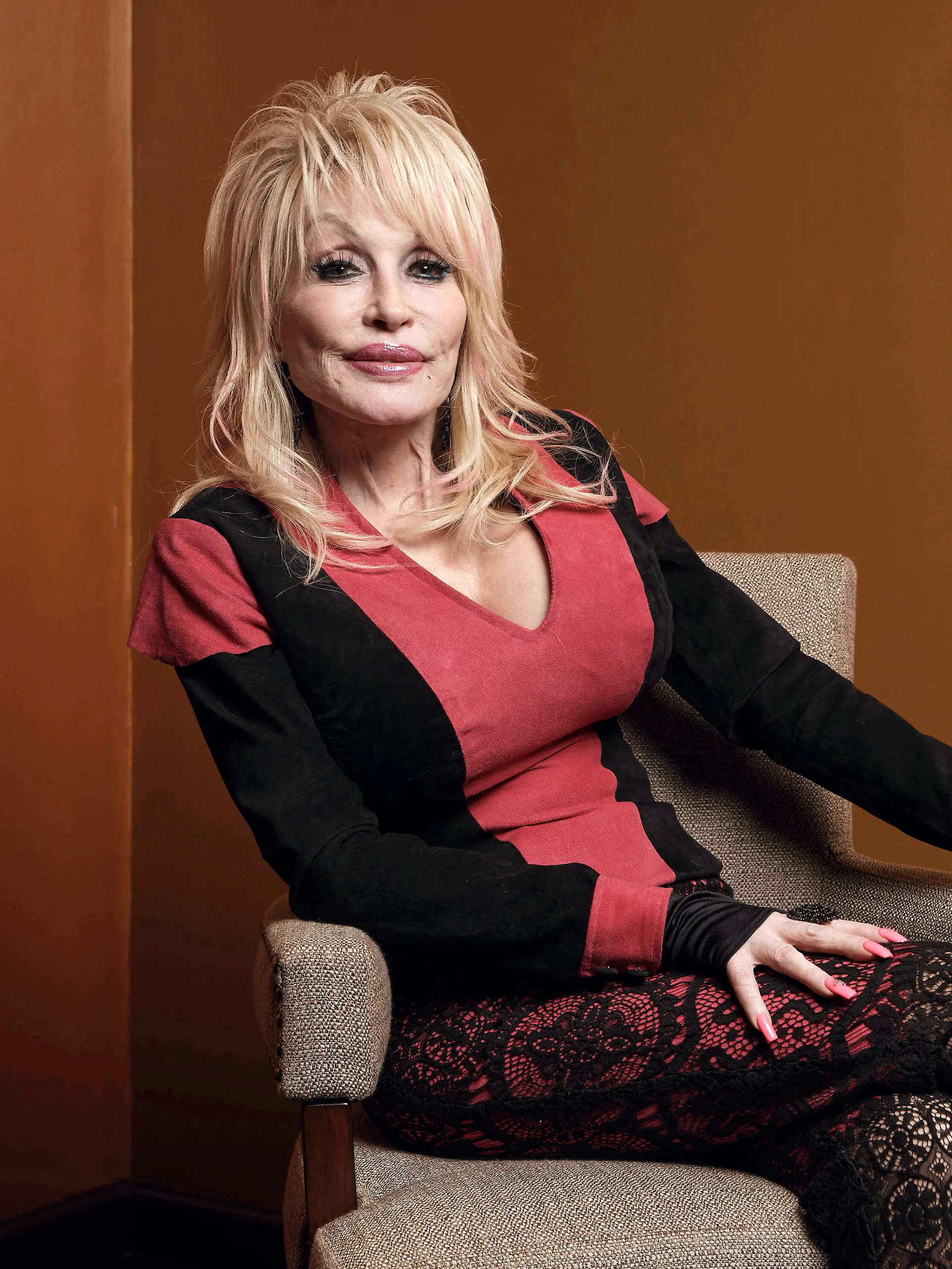 FILE - Dolly Parton poses at the Carnegie Medal of Philanthropy Ceremony in New York on Oct. 13, 2022. Parton will close out the awards show with her performance of “World On Fire,” from her record “Rock Star.” The ACMs will air on May 11 on Prime Video live from Frisco, Texas. (AP Photo/Andres Kudacki, File)