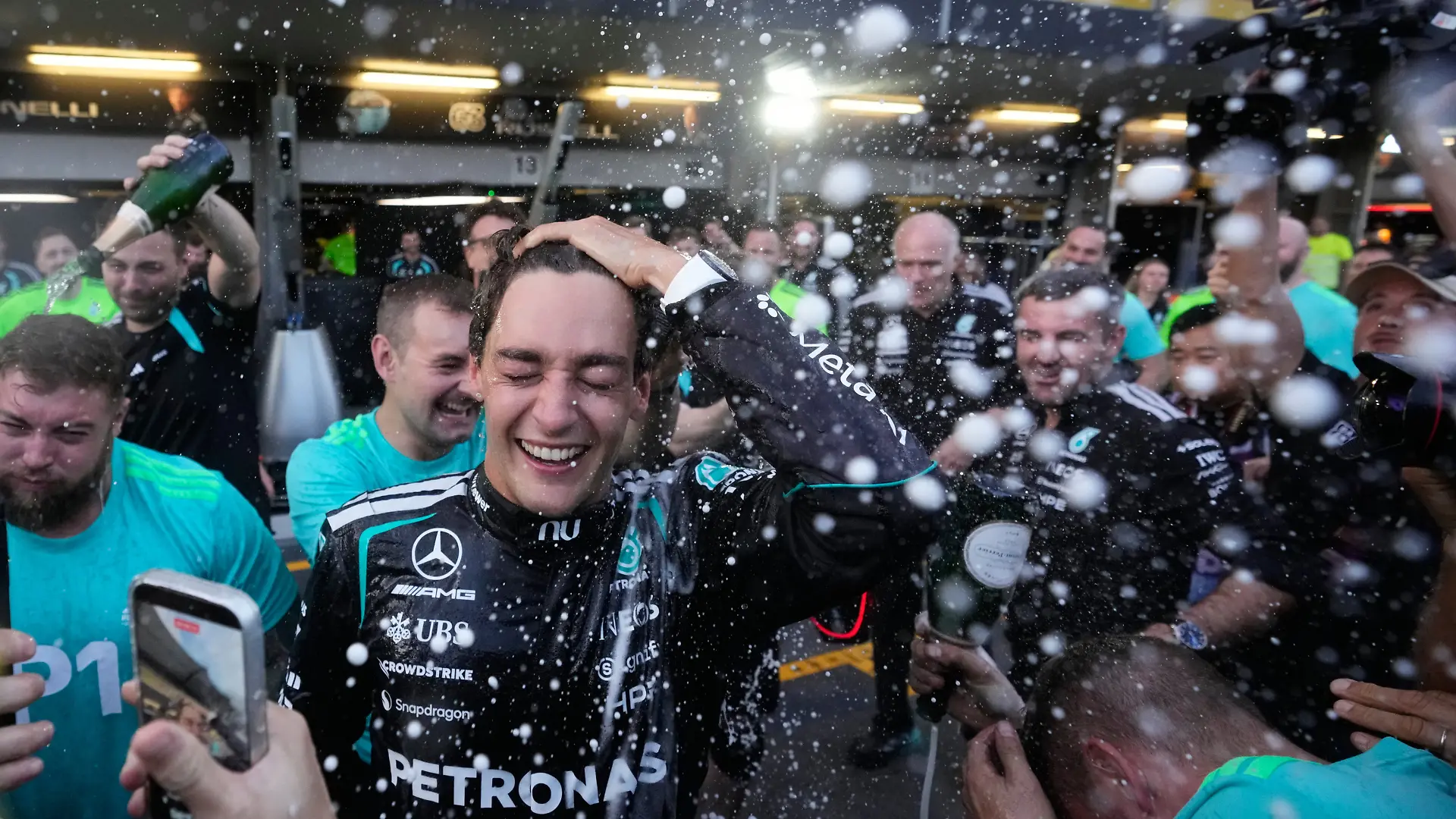 Mercedes driver George Russell of Britain celebrates his victory with team members after the Formula One Azerbaijan Grand Prix auto race in Baku, Azerbaijan, Saturday, Sept. 26, 2026. (AP Photo/Pavel Bednyakov)