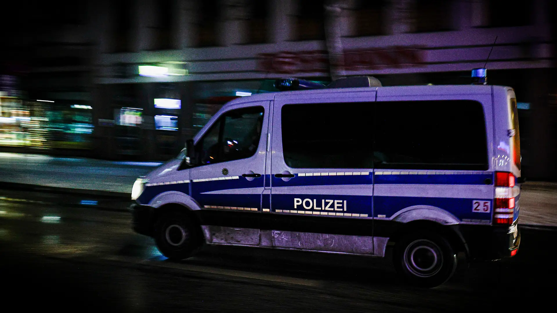 BERLIN, GERMANY - 2026/01/04: A police vehicle drives through darkened streets in the Zehlendorf district as large parts of southwestern Berlin remain affected by a power outage. Emergency services continue patrols in the area while residents face ongoing disruptions. A deliberate arson attack on high-voltage power cables at a bridge over the Teltow Canal in southwestern Berlin caused a blackout affecting 45,000 residents in Zehlendorf. The outage disrupted S-Bahn services and prompted authorities to open emergency shelters. Repairs are ongoing. (Photo by Vasily Krestyaninov/SOPA Images/LightRocket via Getty Images)