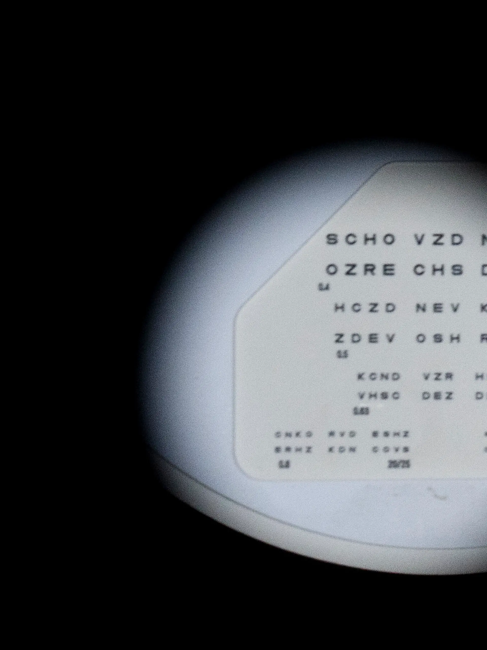 An eye chart is seen through a phoropter, which is used to determine a person's vision correction needs, at an optometrist's office on Tuesday, Oct. 15, 2024, in Portland, Ore. (AP Photo/Jenny Kane)