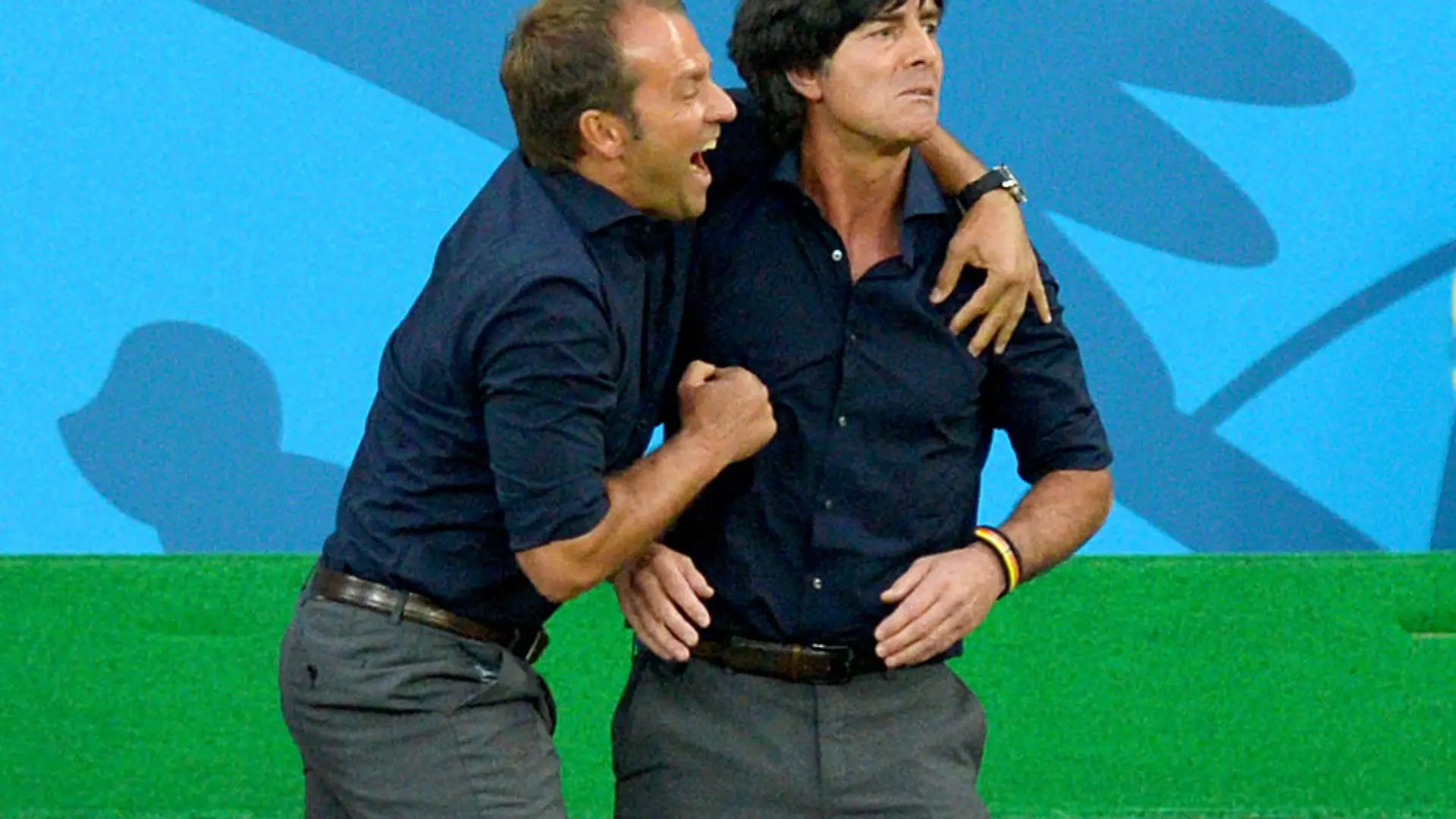 German head coach Joachim Loew (R) and German assistant coach Hansi Flick celebrate a goal during the FIFA World Cup 2014 semi-final soccer match between Brazil and Germany at Estadio Mineirao in Belo Horizonte, Brazil, 08 July 2014. Photo: Thomas Eisenhuth/dpa (RESTRICTIONS APPLY: Editorial Use Only, not used in association with any commercial entity - Images must not be used in any form of alert service or push service of any kind including via mobile alert services, downloads to mobile devices or MMS messaging - Images must appear as still images and must not emulate match action video footage - No alteration is made to, and no text or image is superimposed over, any published image which: (a) intentionally obscures or removes a sponsor identification image; or (b) adds or overlays the commercial identification of any third party which is not officially associated with the FIFA World Cup) EDITORIAL USE ONLY +++(c) dpa - Bildfunk+++