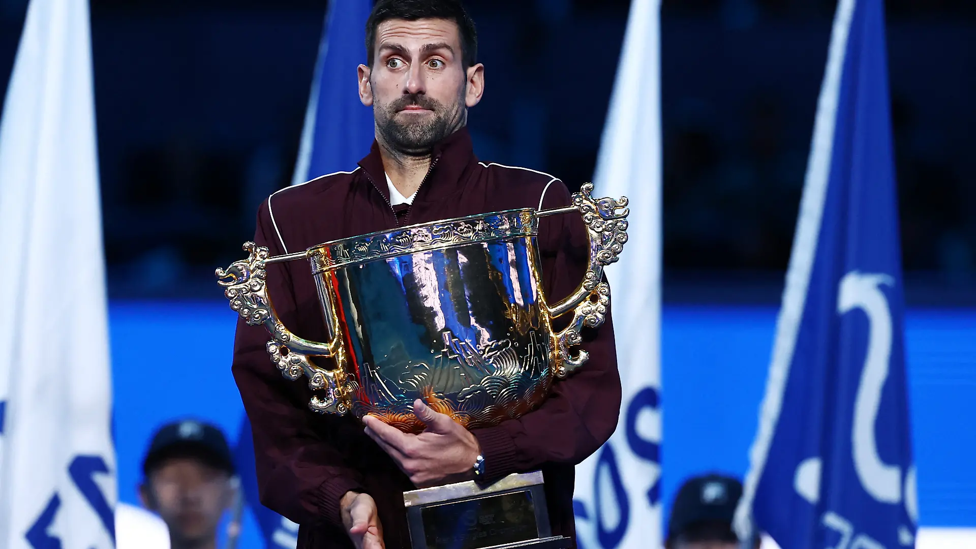 Tennis - China Open - National Tennis Center, Beijing, China - October 6, 2026 Serbia's Novak Djokovic reacts with the trophy after winning the final against Australia's Alex de Minaur REUTERS/Tingshu Wang