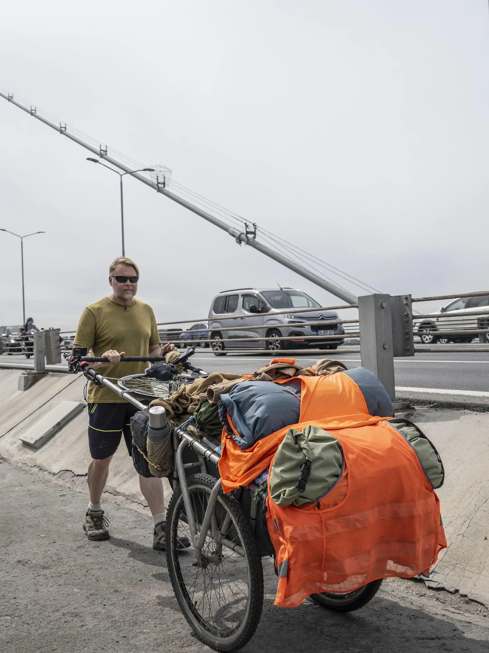 ISTANBUL, TURKIYE - MAY 2: British traveler Karl Bushby crosses the 15 July Martyrs Bridge from Asia to Europe with special permission in Istanbul, Turkiye on May 2, 2025. Bushby sets out from Chile 26 years ago to reach his home and came to Istanbul to prove that the journey between continents can be made only on foot. Murat Sengul / Anadolu