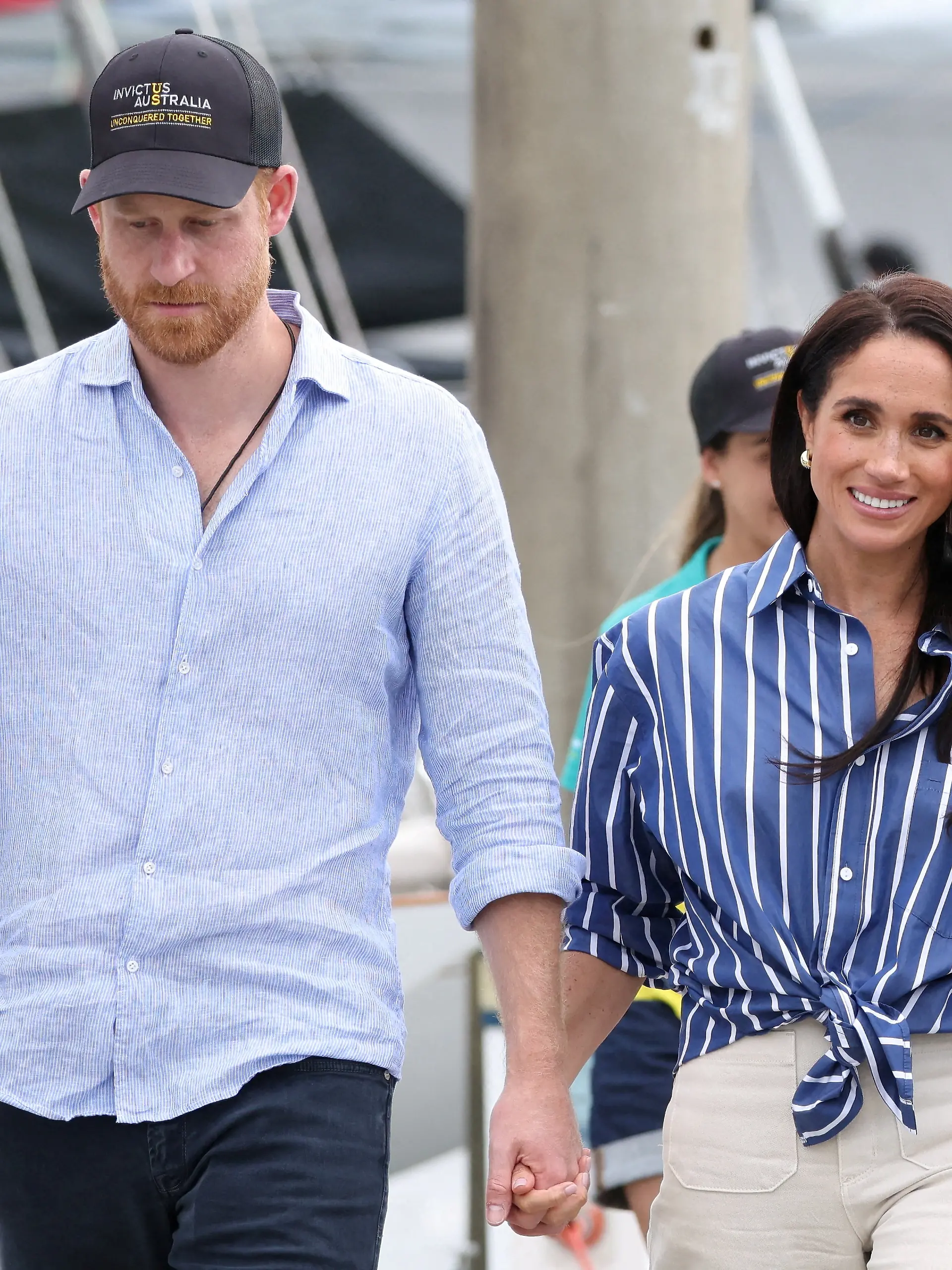 FILE PHOTO: Britain's Prince Harry and Meghan, the Duke and Duchess of Sussex, visit Sydney