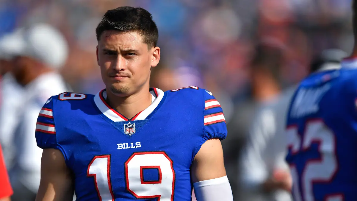 FILE -Buffalo Bills punter Matt Araiza walks on the sideline during the first half of a preseason NFL football game against the Indianapolis Colts in Orchard Park, N.Y., Saturday, Aug. 13, 2022. Former Buffalo Bills punter Matt Araiza was not present when an alleged gang rape of a minor occurred at an October 2021 party in San Diego nor was he visible in videos recovered after the incident, which led to a police investigation and a lawsuit by the woman who said she was attacked, according to witness testimony. (AP Photo/Adrian Kraus, File)