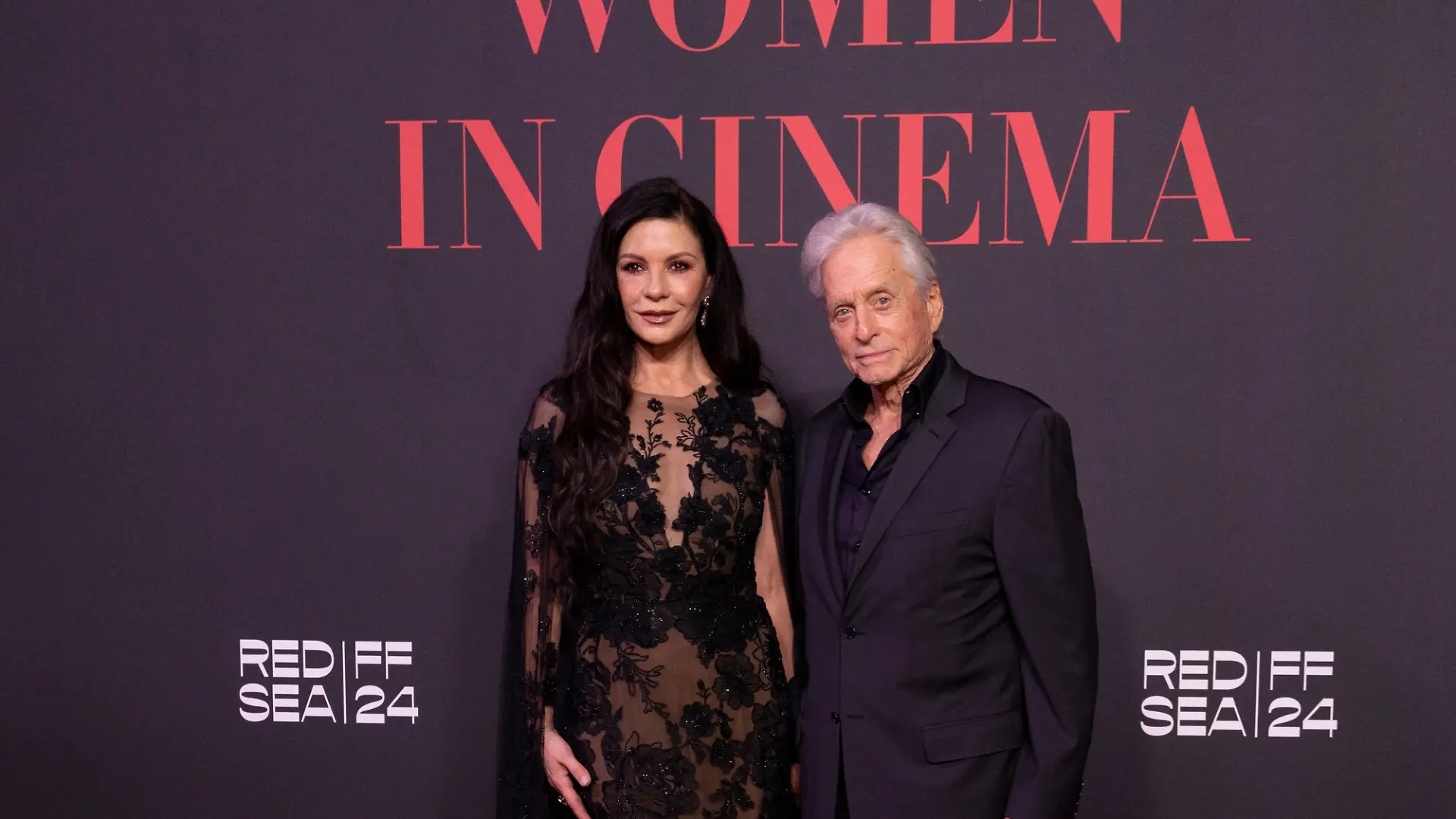 Catherine Zeta-Jones and Michael Douglas pose for photographers upon arrival at the Women in Cinema event during the Red Sea International Film Festival in Jeddah, Saudi Arabia, Saturday, Dec. 7, 2024. (Photo by Joel C Ryan/Invision/AP)