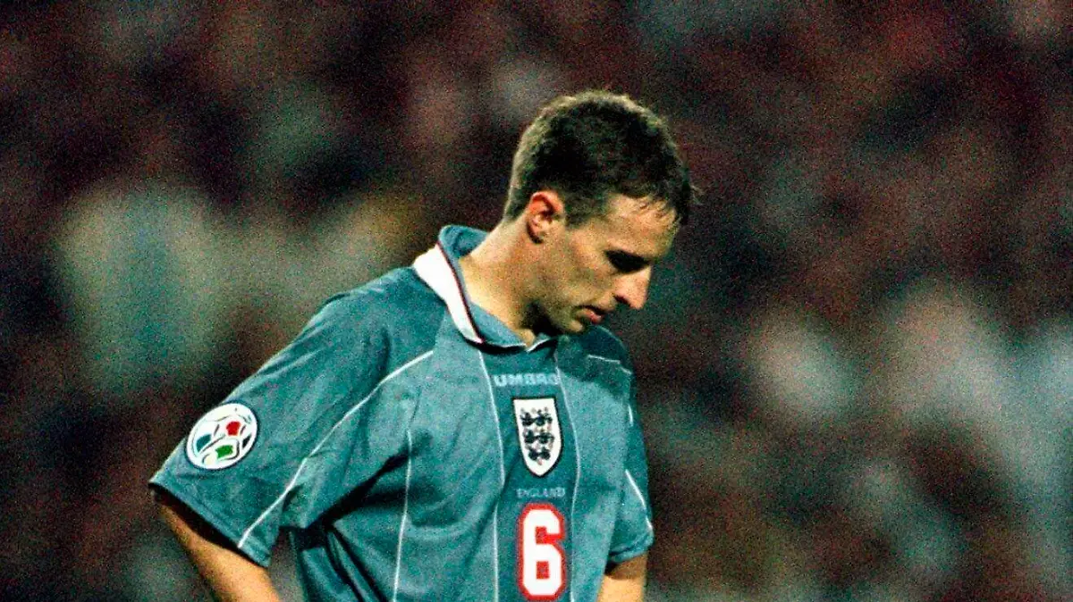 FILE - In this June 26, 1996 file photo England's Gareth Southgate bows his head after missing from the spot during a penalty shootout in the European Soccer Championships semi-final match against England at London's Wembley Stadium. Germany won 6-5 on penalties after the match finished 1-1 following extra time. Current England coach Gareth Southgate missed the decisive kick in the shootout, and Germany went on to win the title. (AP Photo/Lynne Sladky, File)