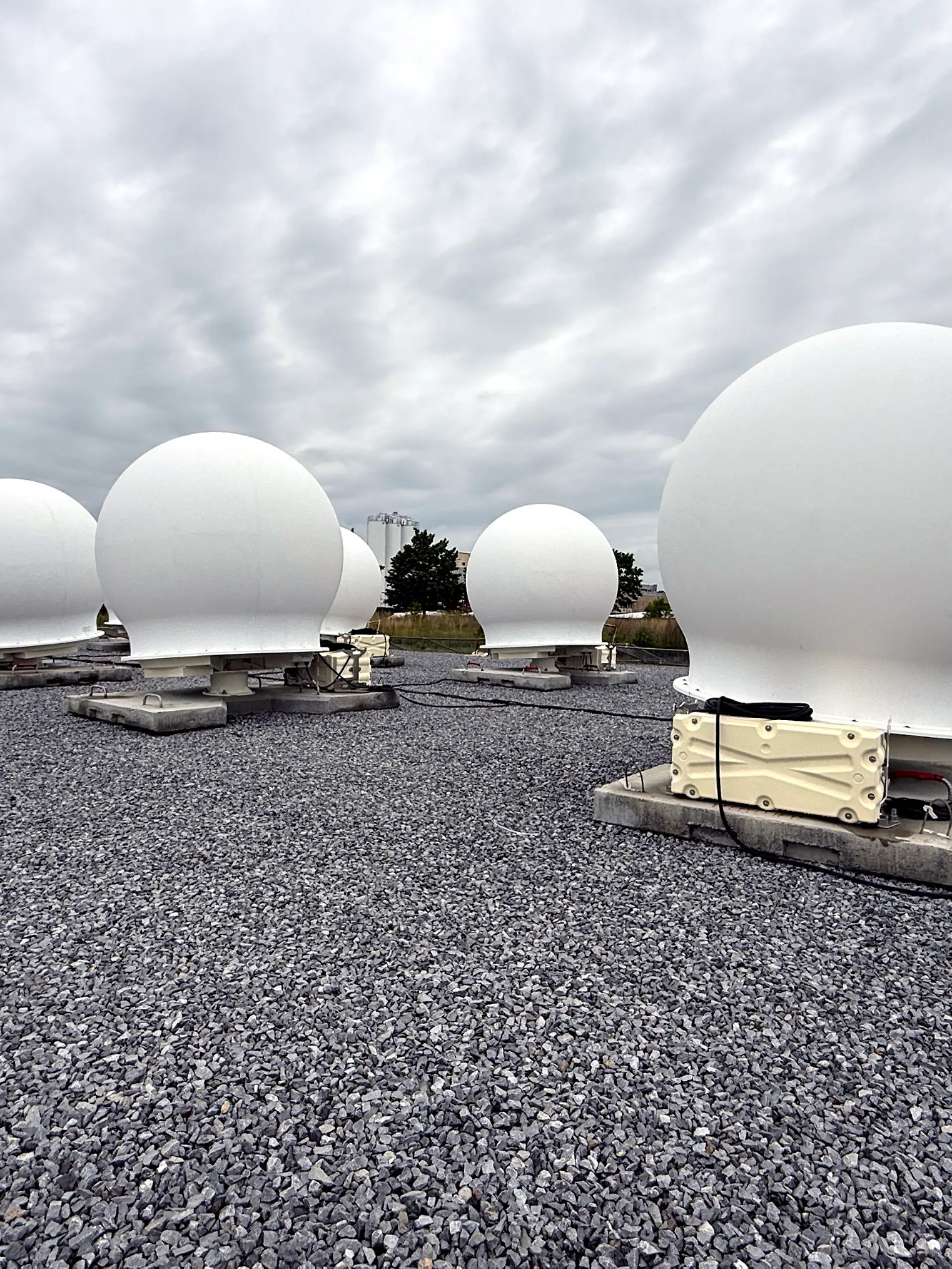 Calverton, N.Y.: Some of the 40 white orb earth satellite stations that were installed in Calverton, New York, and which can communicate with Starlink satellites in space, are seen on May 14, 2025. (Photo by James Carbone/Newsday RM via Getty Images)