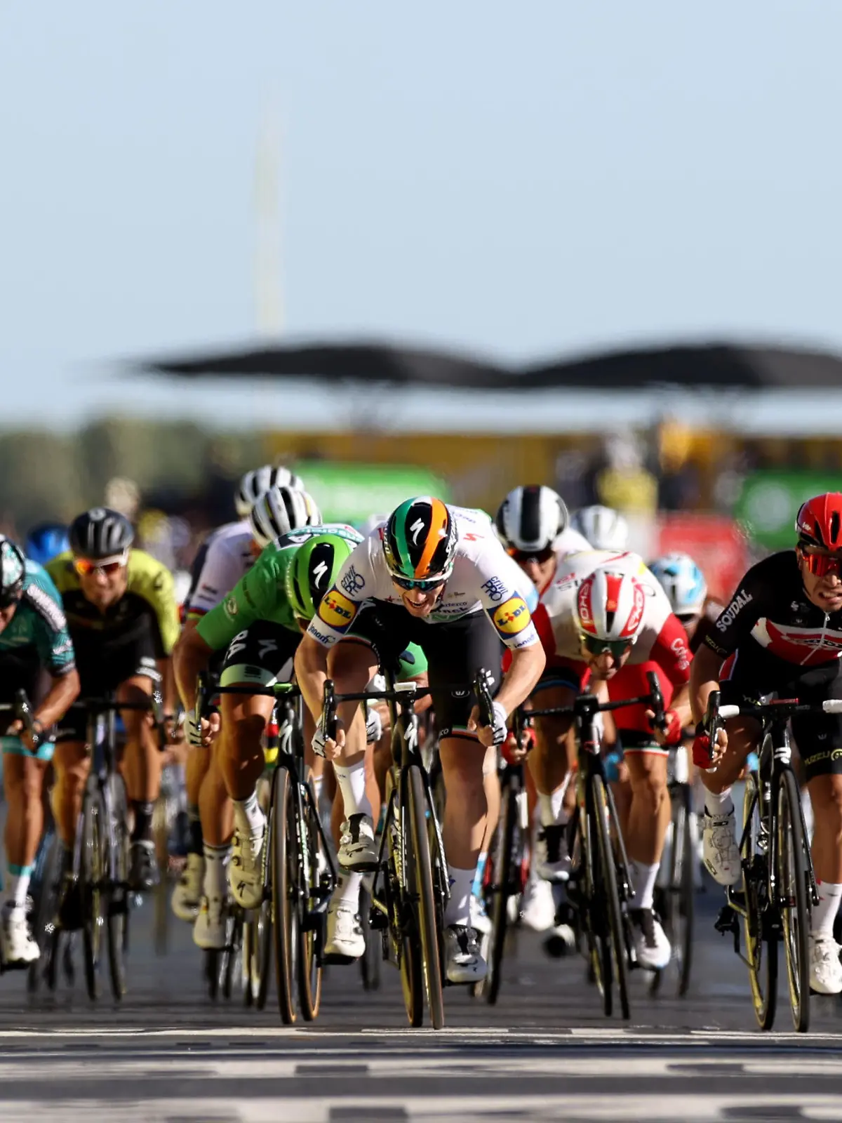 Cycling - Tour de France - Stage 10 - Ile d'Oleron to Ile de Re - France - September 8, 2020. BORA-Hansgrohe rider Peter Sagan of Slovakia, wearing the green jersey, Deceuninck-Quick Step rider Sam Bennett of Ireland and Lotto Soudal rider Caleb Ewan of Australia sprint toward the line. Pool via REUTERS/Kenzo Tribouillard