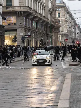 IPA89867555 - Milan, October 18, 2026: More Clashes and Looting in Downtown Milan the Day After the Protest Pictured: A Local Police Patrol Car Under Attack PUBLICATIONxNOTxINxITA Copyright: xFrancescoxEnriquezx/xFrancescoxEnriquezx IPA89867555