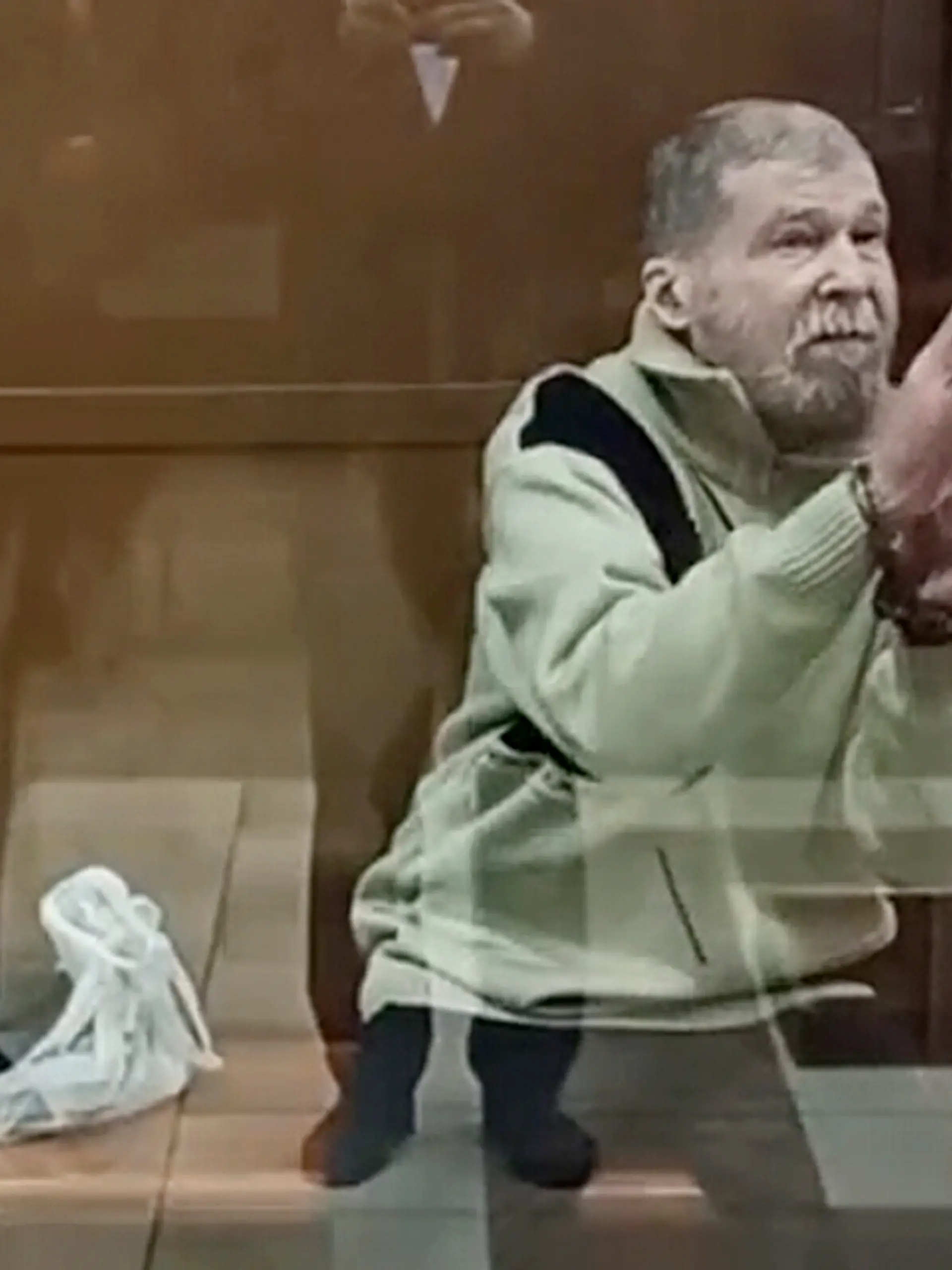 FILE - In this photo taken from video released by the Moscow City Court Press Service, Stephen Hubbard, a U.S. citizen accused of fighting as a mercenary in Ukraine against Russia stands in a glass cage during a court session in the Moscow City court in Moscow, Russia, Oct. 7, 2024. (Moscow City Court Press Service via AP, File)